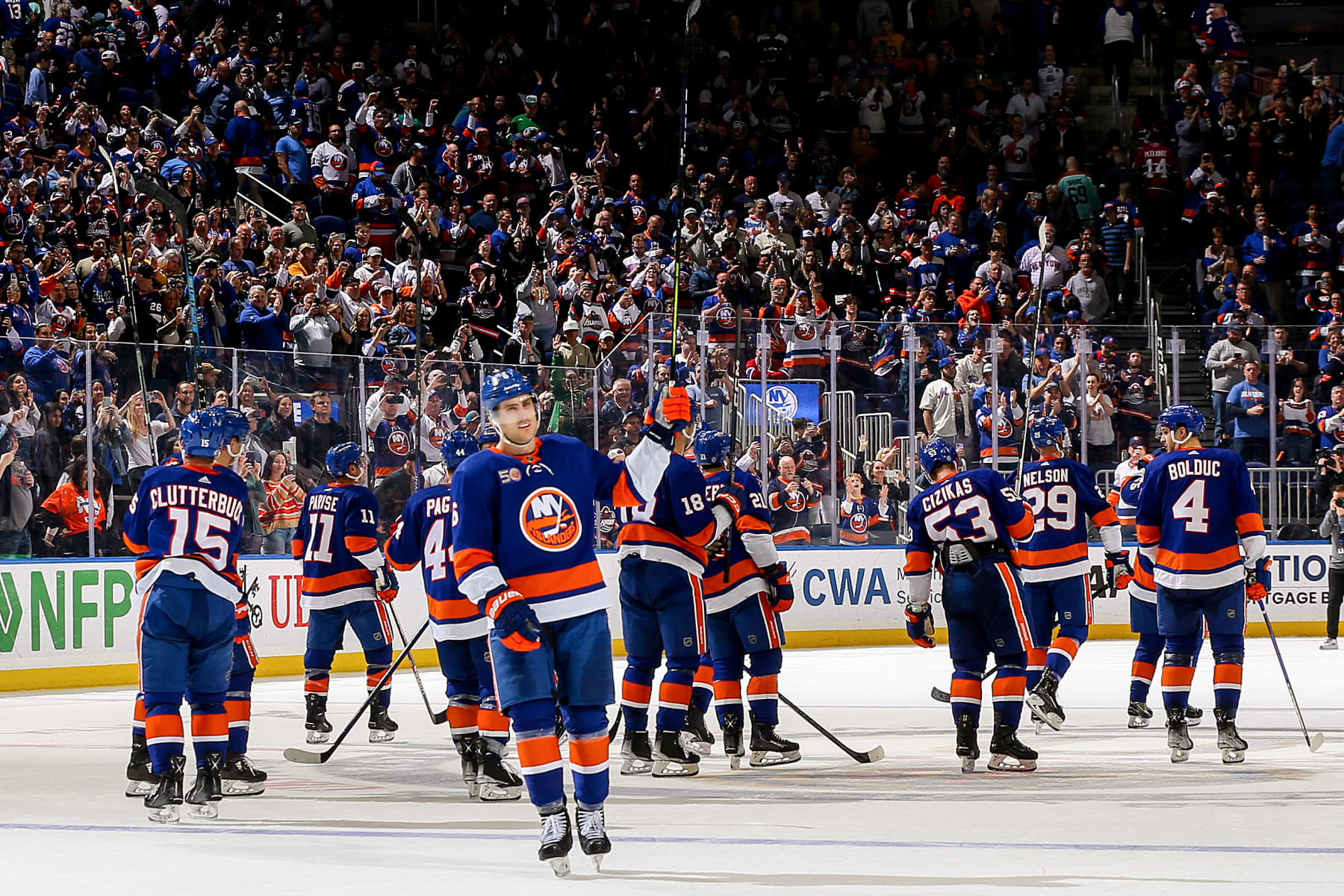 ELMONT, NEW YORK - APRIL 12:  The New York Islanders celebrate their 4-2 victory against the Montreal Canadiens to secure a place in the Stanley Cup Playoffs at UBS Arena on April 12, 2023 in Elmont, New York. (Photo by Mike Stobe/NHLI via Getty Images)