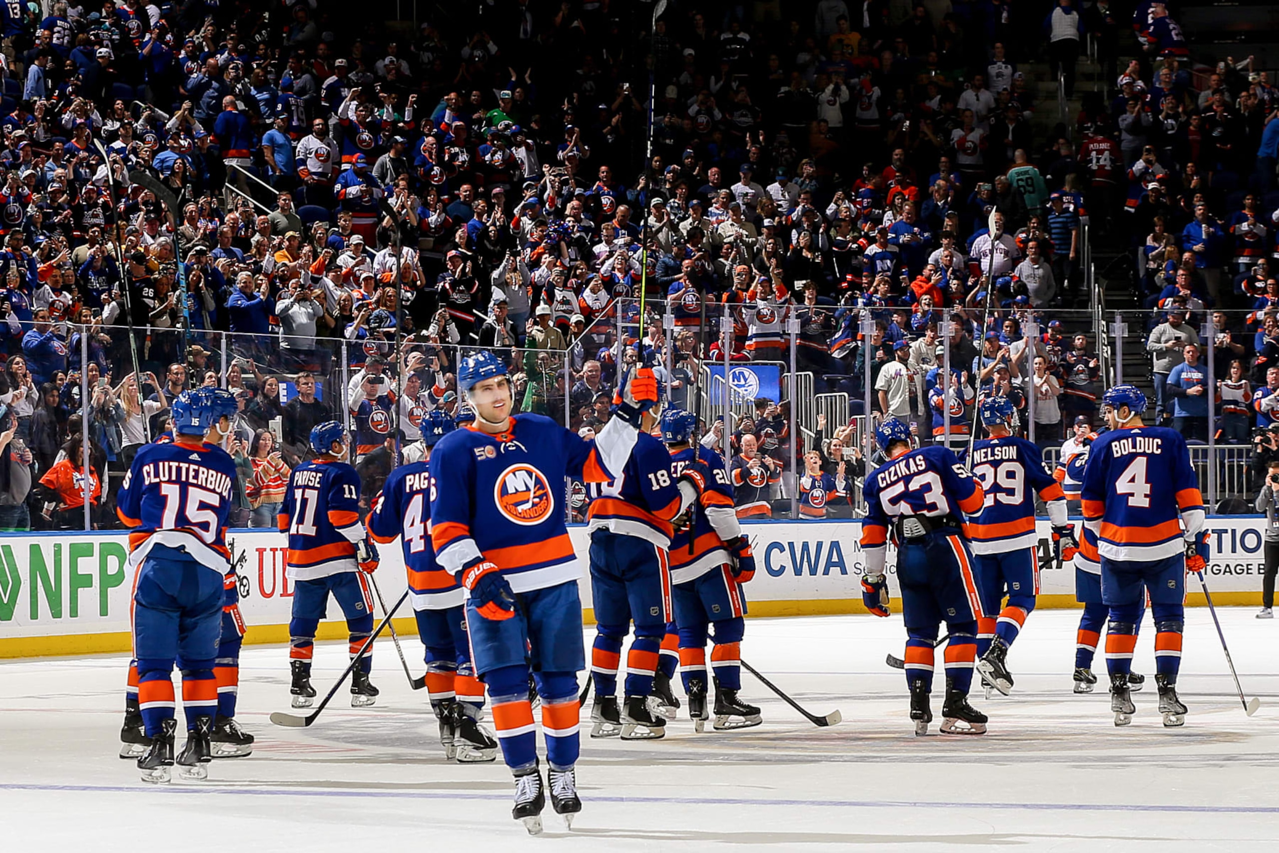 ELMONT, NEW YORK - APRIL 12:  The New York Islanders celebrate their 4-2 victory against the Montreal Canadiens to secure a place in the Stanley Cup Playoffs at UBS Arena on April 12, 2023 in Elmont, New York. (Photo by Mike Stobe/NHLI via Getty Images)