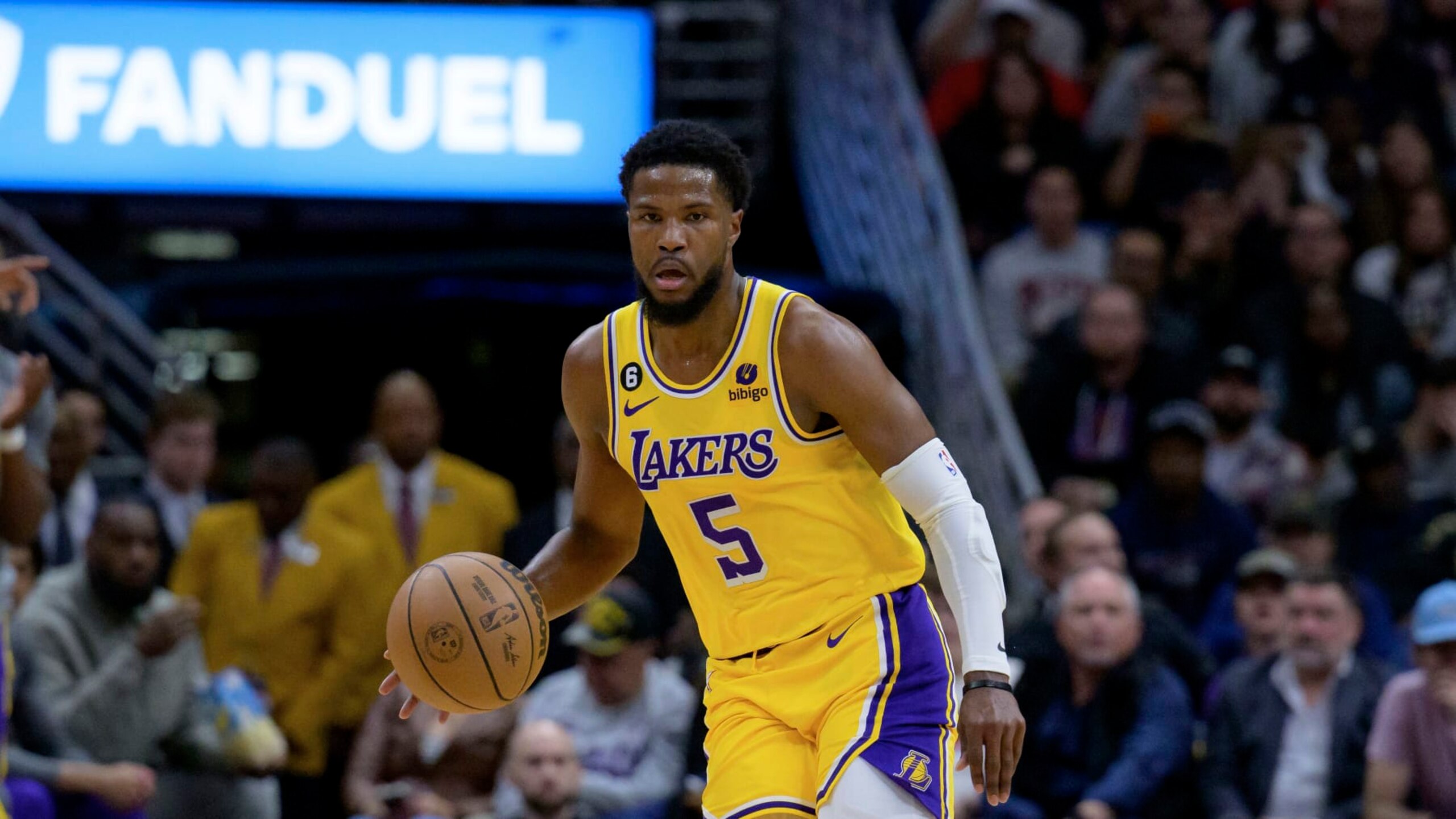Los Angeles Lakers guard Malik Beasley (5) dribbles in the first half of an NBA basketball game against the New Orleans Pelicans in New Orleans, Tuesday, March 14, 2023. (AP Photo/Matthew Hinton)