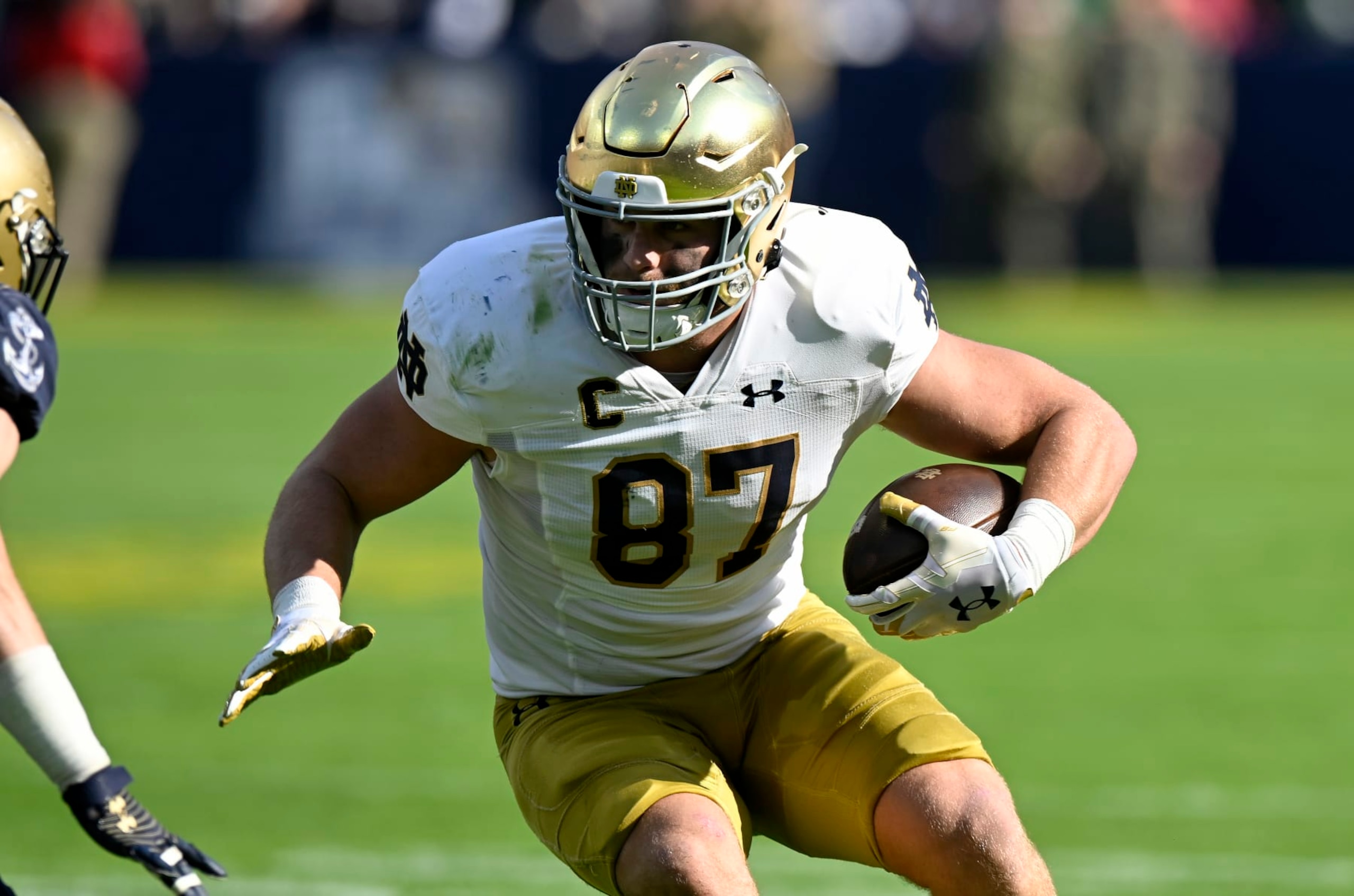 BALTIMORE, MARYLAND - NOVEMBER 12: Michael Mayer #87 of the Notre Dame Fighting Irish runs with the ball after making a catch against the Navy Midshipmen at M&T Bank Stadium on November 12, 2022 in Baltimore, Maryland. (Photo by G Fiume/Getty Images)