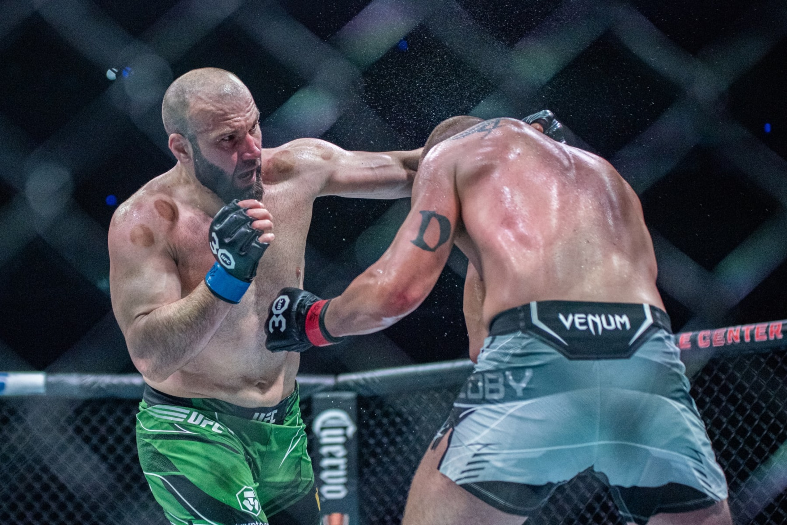 KANSAS CITY, MISSOURI - APRIL 15: (L-R) Azamat Murzakanov punches Dustin Jacoby in a light-heavyweight bout during UFC Fight Night Kansas City on April 15, 2023, at T-Mobile Center in Kansas City, Missouri. (Photo by Matt Davies/PxImages/Icon Sportswire via Getty Images)