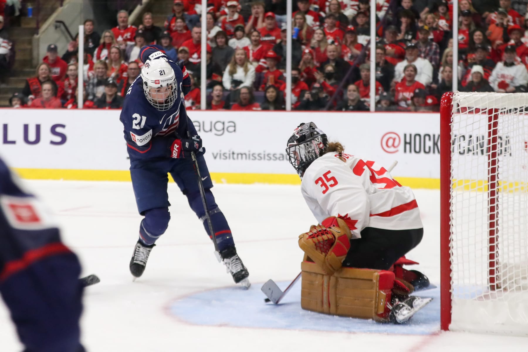 BRAMPTON, ONTARIO - APRIL 16: Forward Hilary Knight #21 of USA scores her second period goal against goaltender Ann-Renee Desbiens #35 of Canada during the gold medal game of the 2023 IIHF Women's World Championship at CAA Centre on April 16, 2023 in Brampton, Ontario. (Photo by Dennis Pajot/Getty Images)