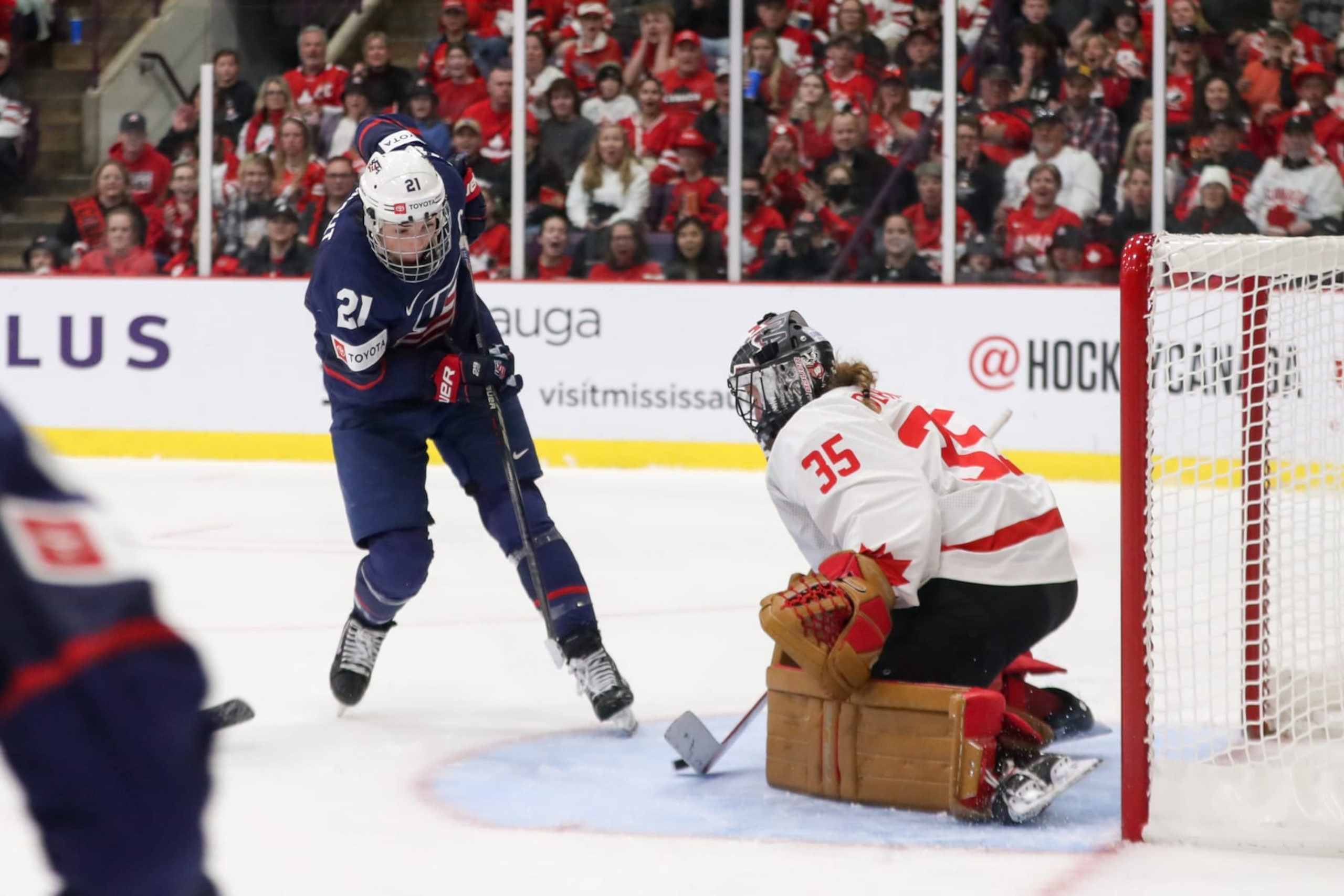 BRAMPTON, ONTARIO - APRIL 16: Forward Hilary Knight #21 of USA scores her second period goal against goaltender Ann-Renee Desbiens #35 of Canada during the gold medal game of the 2023 IIHF Women's World Championship at CAA Centre on April 16, 2023 in Brampton, Ontario. (Photo by Dennis Pajot/Getty Images)