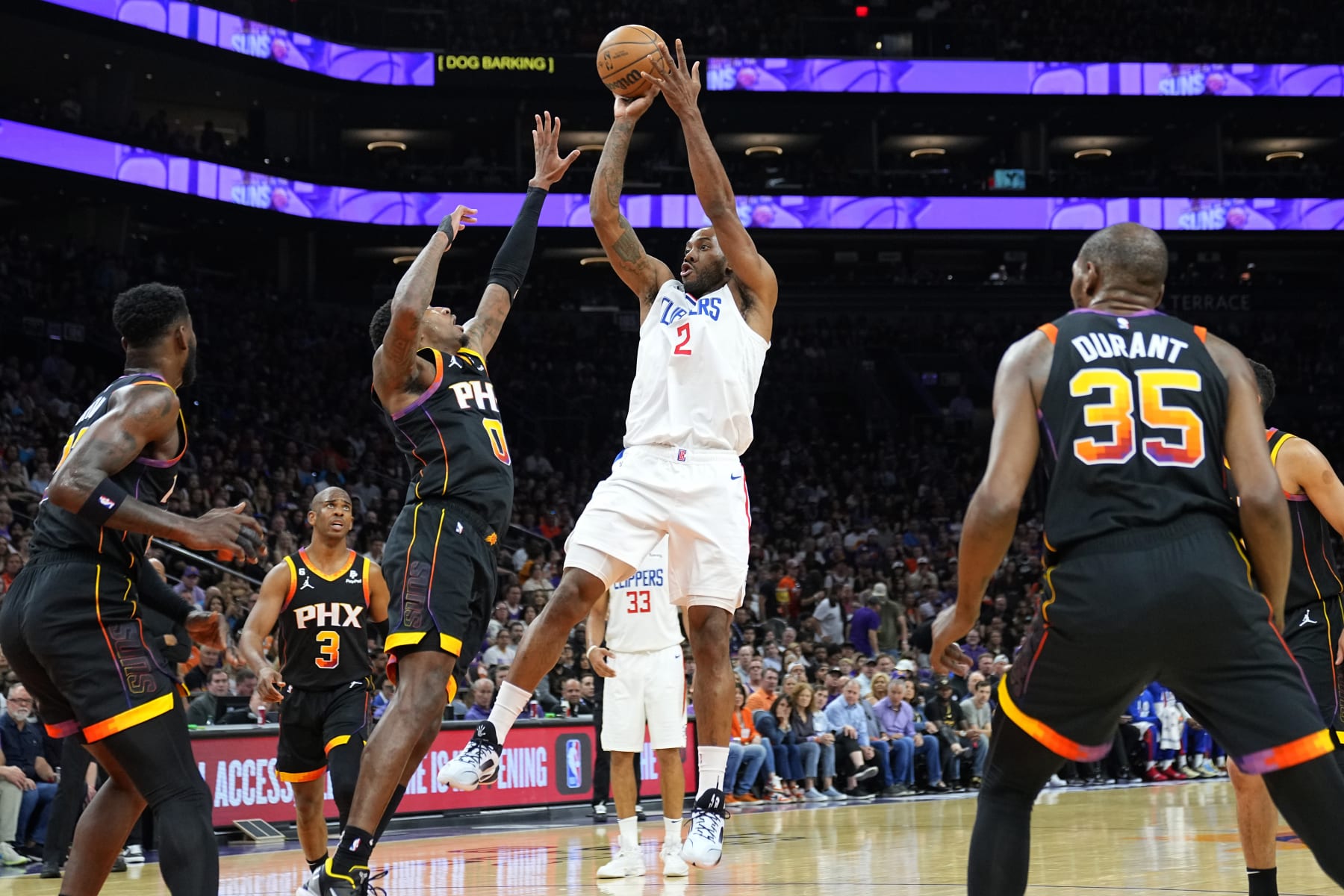 Los Angeles Clippers forward Kawhi Leonard (2) shoots over Phoenix Suns forward Torrey Craig during Game 1 of a first-round NBA basketball playoff series, Sunday, April 16, 2023, in Phoenix. (AP Photo/Matt York)
