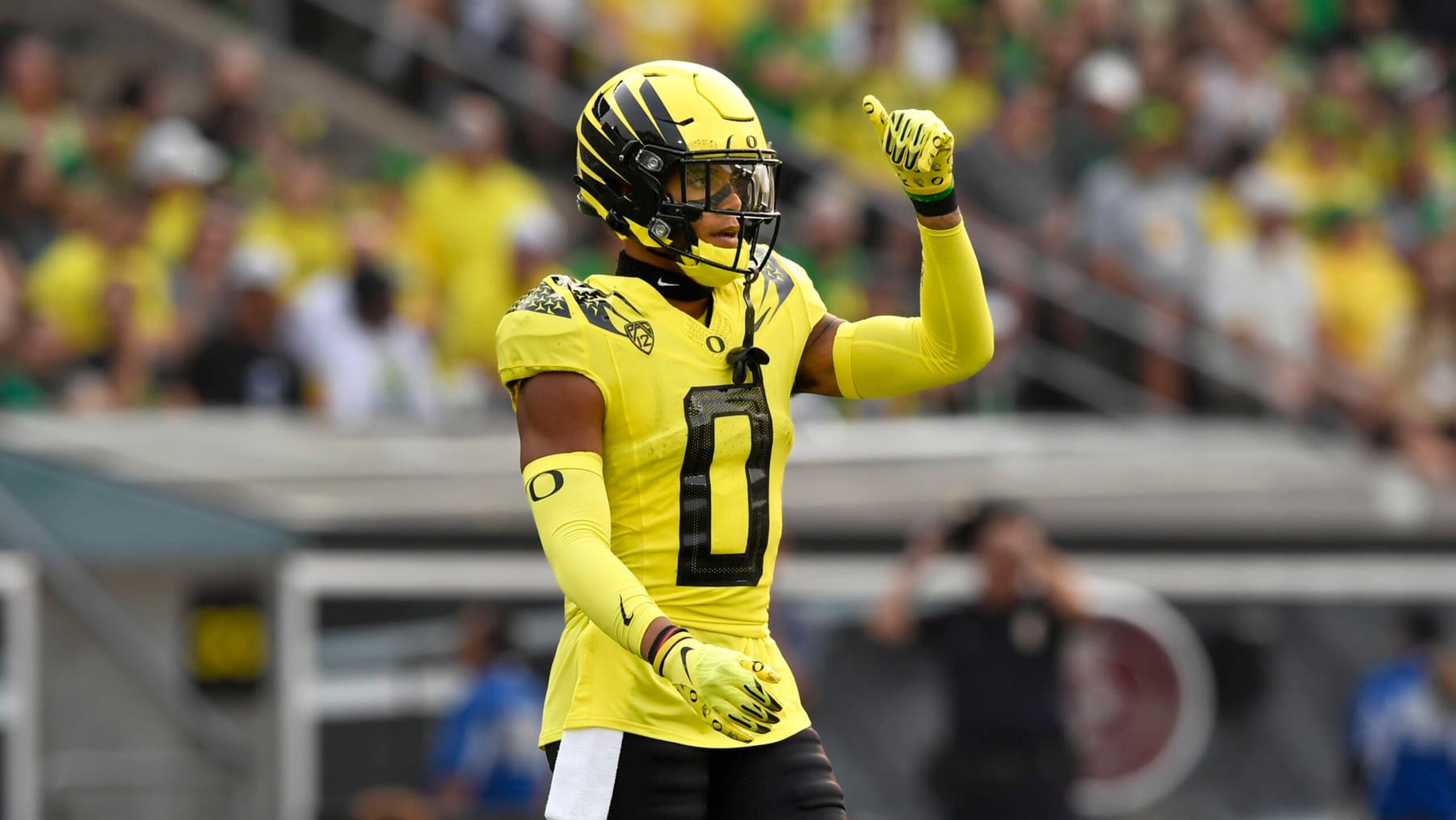 Oregon defensive back Christian Gonzalez (0) checks on defensive calls against Eastern Washington during the first quarter of an NCAA college football game Saturday, Sept. 10, 2022, in Eugene, Ore. (AP Photo/Andy Nelson)