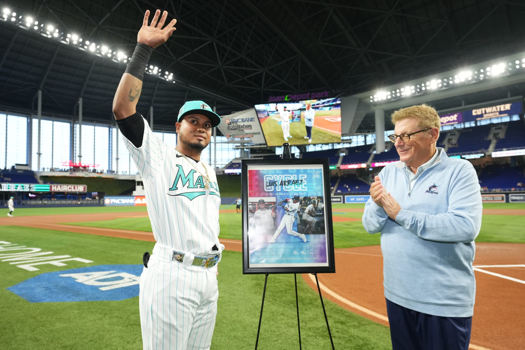 MIAMI, FL - APRIL 14: Luis Arraez #3 of the Miami Marlins receives a special poster from princable owner Bruce Sherman commemorating his cycle against the Philadelpia Phillies on April 11, 2023 prior to the game against the Arizona Diamondbacks at loanDepot park on April 14, 2023 in Miami, Florida. (Photo by Jasen Vinlove/Miami Marlins/Contributor)