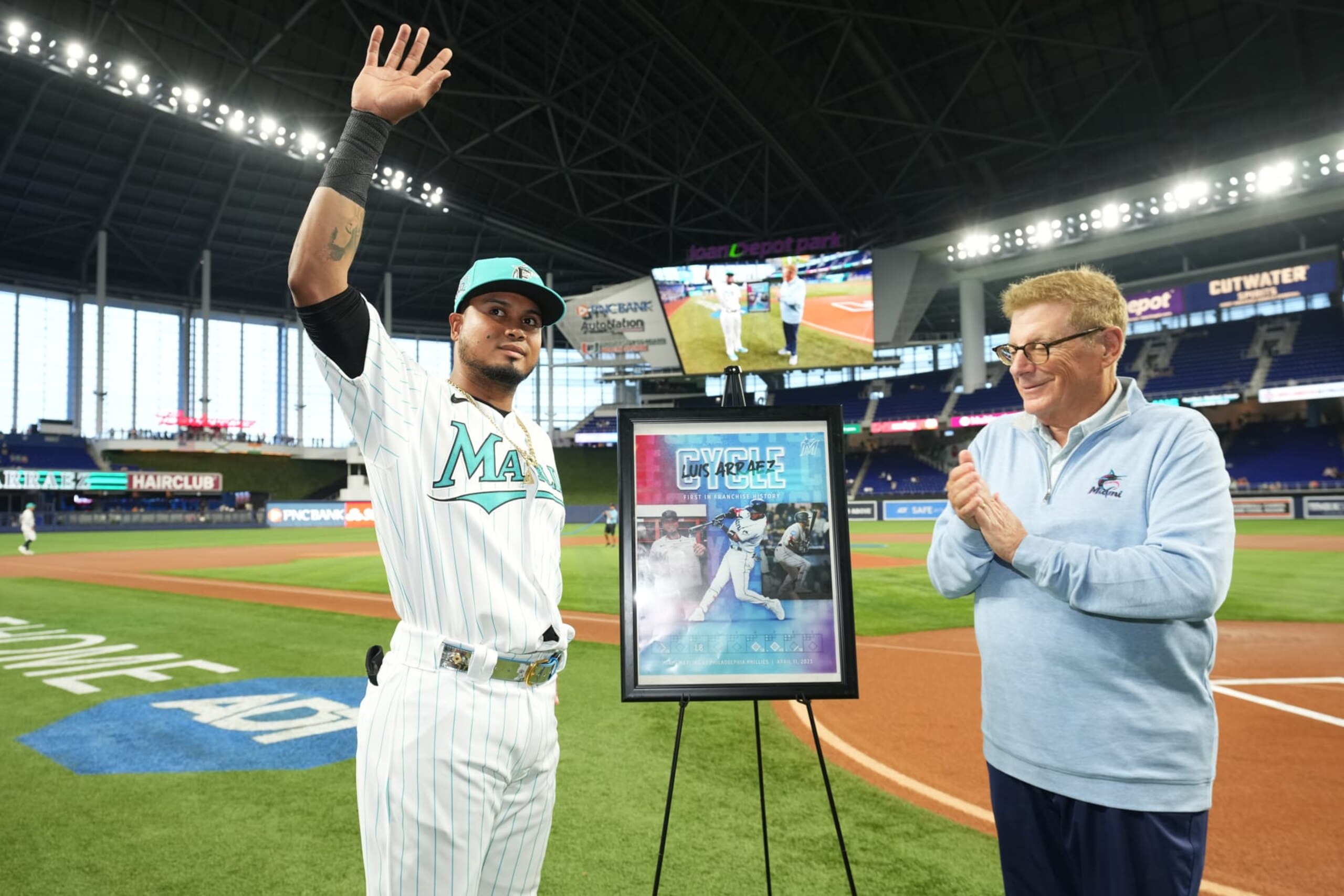 MIAMI, FL - APRIL 14: Luis Arraez #3 of the Miami Marlins receives a special poster from princable owner Bruce Sherman commemorating his cycle against the Philadelpia Phillies on April 11, 2023 prior to the game against the Arizona Diamondbacks at loanDepot park on April 14, 2023 in Miami, Florida. (Photo by Jasen Vinlove/Miami Marlins/Contributor)