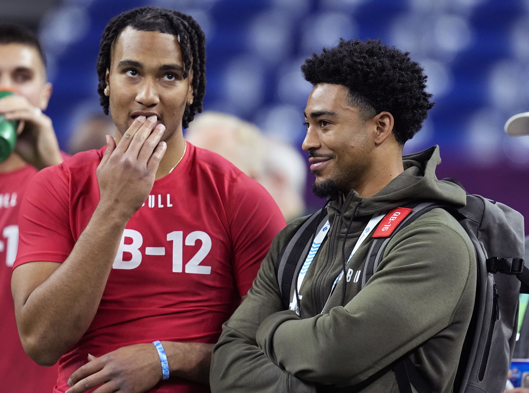 FILE - Ohio State quarterback CJ Stroud, left, talks to Alabama quarterback Bryce Young at the NFL football scouting combine in Indianapolis, Saturday, March 4, 2023. The Carolina Panthers have been on the clock since making a blockbuster trade last month to acquire the No. 1 overall pick in the NFL draft and get their choice of potential franchise quarterbacks. There is still no general consensus on which QB will go first. Stroud or Young? (AP Photo/Darron Cummings, File)