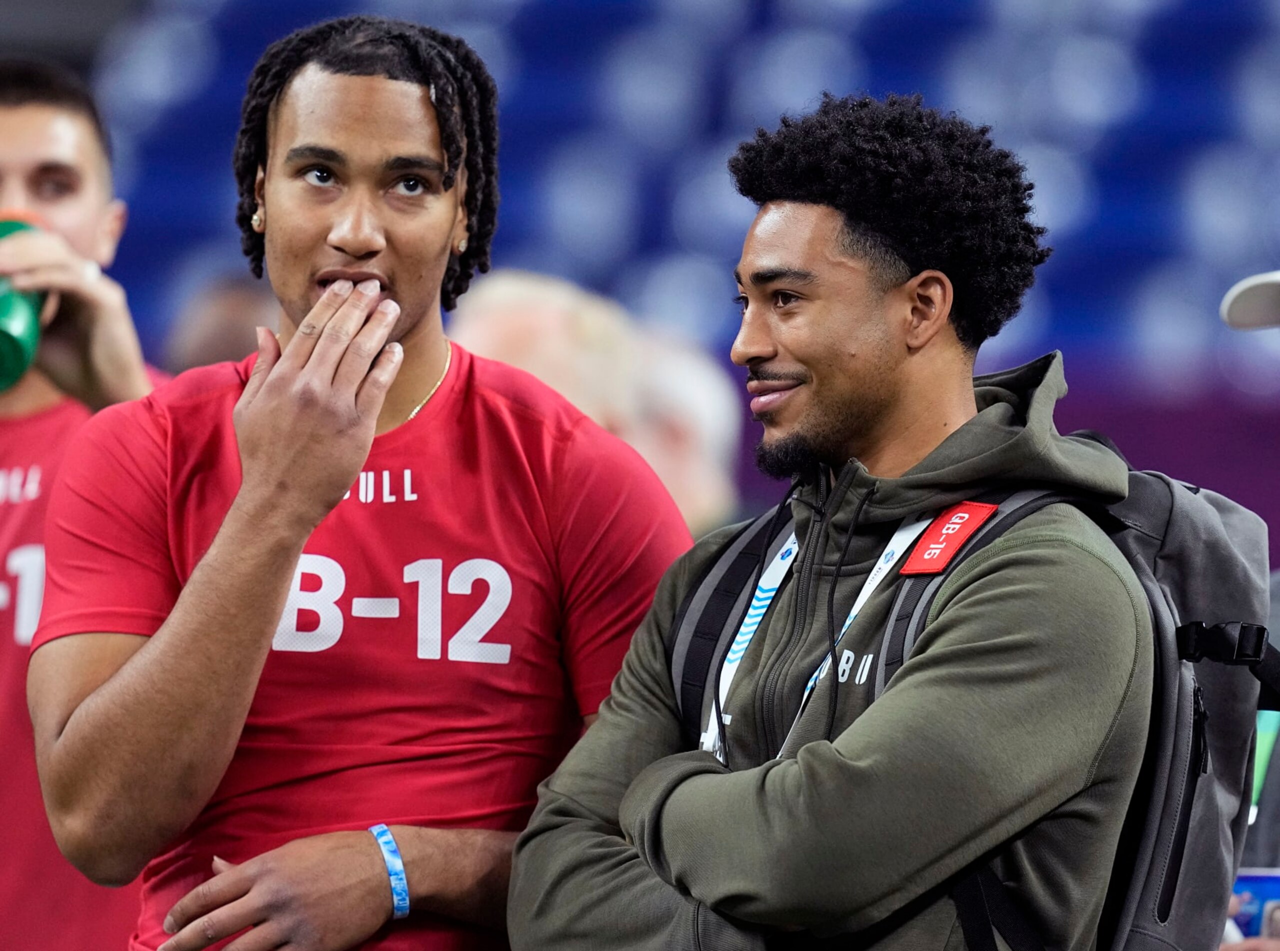 FILE - Ohio State quarterback CJ Stroud, left, talks to Alabama quarterback Bryce Young at the NFL football scouting combine in Indianapolis, Saturday, March 4, 2023. The Carolina Panthers have been on the clock since making a blockbuster trade last month to acquire the No. 1 overall pick in the NFL draft and get their choice of potential franchise quarterbacks. There is still no general consensus on which QB will go first. Stroud or Young? (AP Photo/Darron Cummings, File)