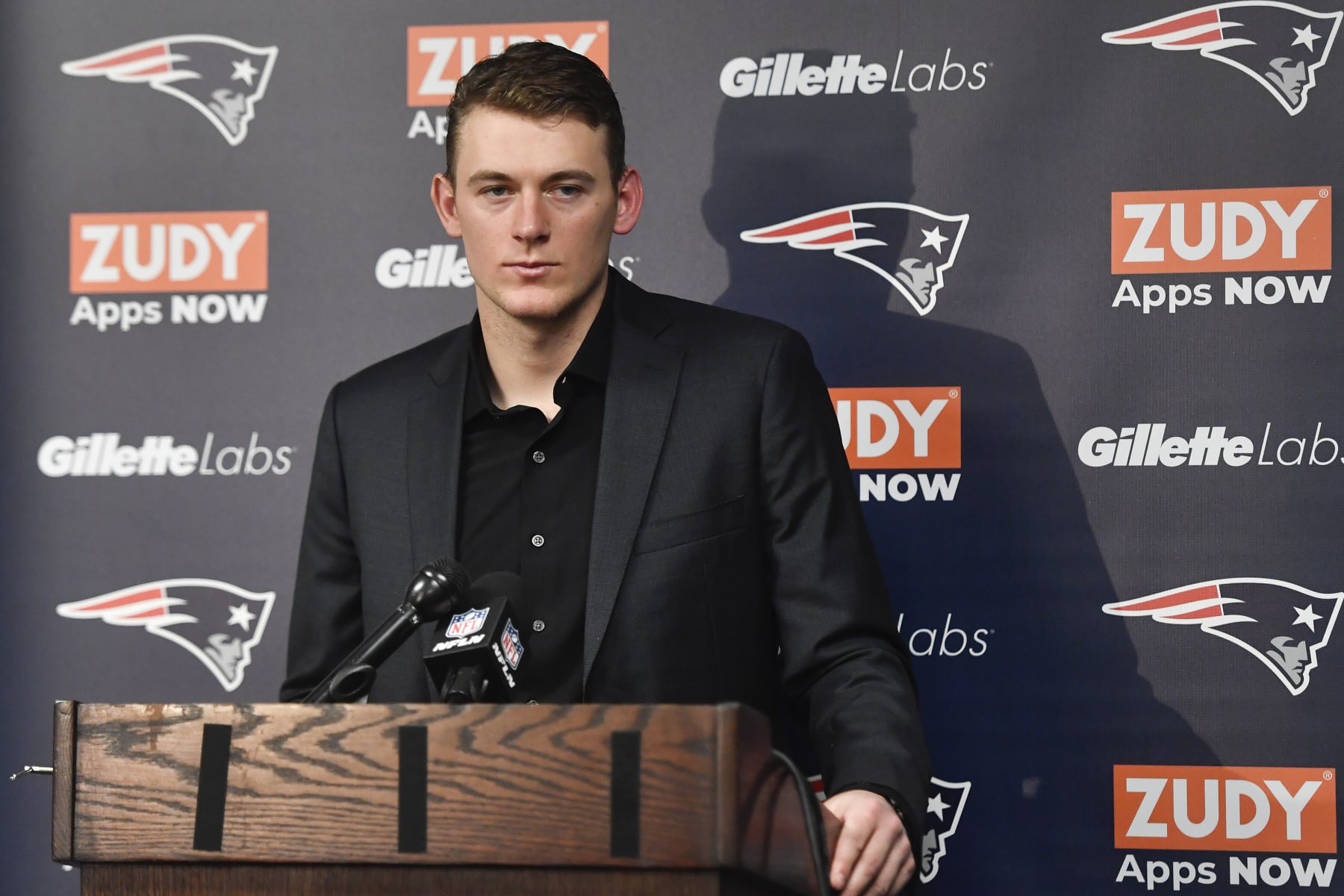 New England Patriots quarterback Mac Jones (10) speaks during a news conference after their NFL football game against the Buffalo Bills, Sunday, Jan. 8, 2023, in Orchard Park. (AP Photo/Adrian Kraus)
