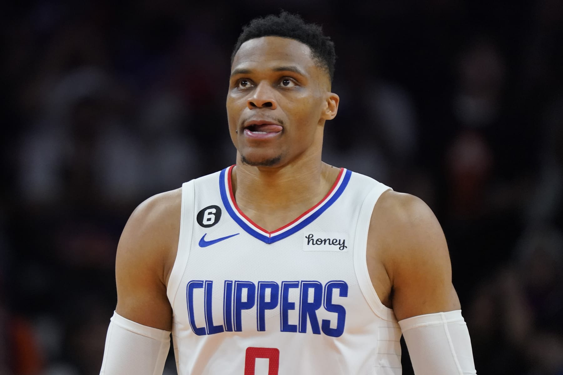 Los Angeles Clippers guard Russell Westbrook watches during the second half of Game 1 of a first-round NBA basketball playoff series against the Phoenix Suns, Sunday, April 16, 2023, in Phoenix. (AP Photo/Matt York)