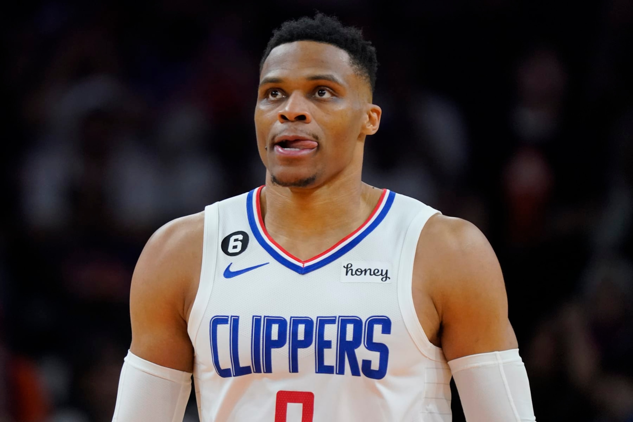 Los Angeles Clippers guard Russell Westbrook watches during the second half of Game 1 of a first-round NBA basketball playoff series against the Phoenix Suns, Sunday, April 16, 2023, in Phoenix. (AP Photo/Matt York)