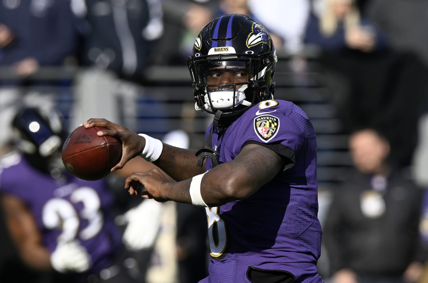 BALTIMORE, MARYLAND - DECEMBER 04: Lamar Jackson #8 of the Baltimore Ravens warms up before the game against the Denver Broncos at M&T Bank Stadium on December 04, 2022 in Baltimore, Maryland. (Photo by G Fiume/Getty Images)