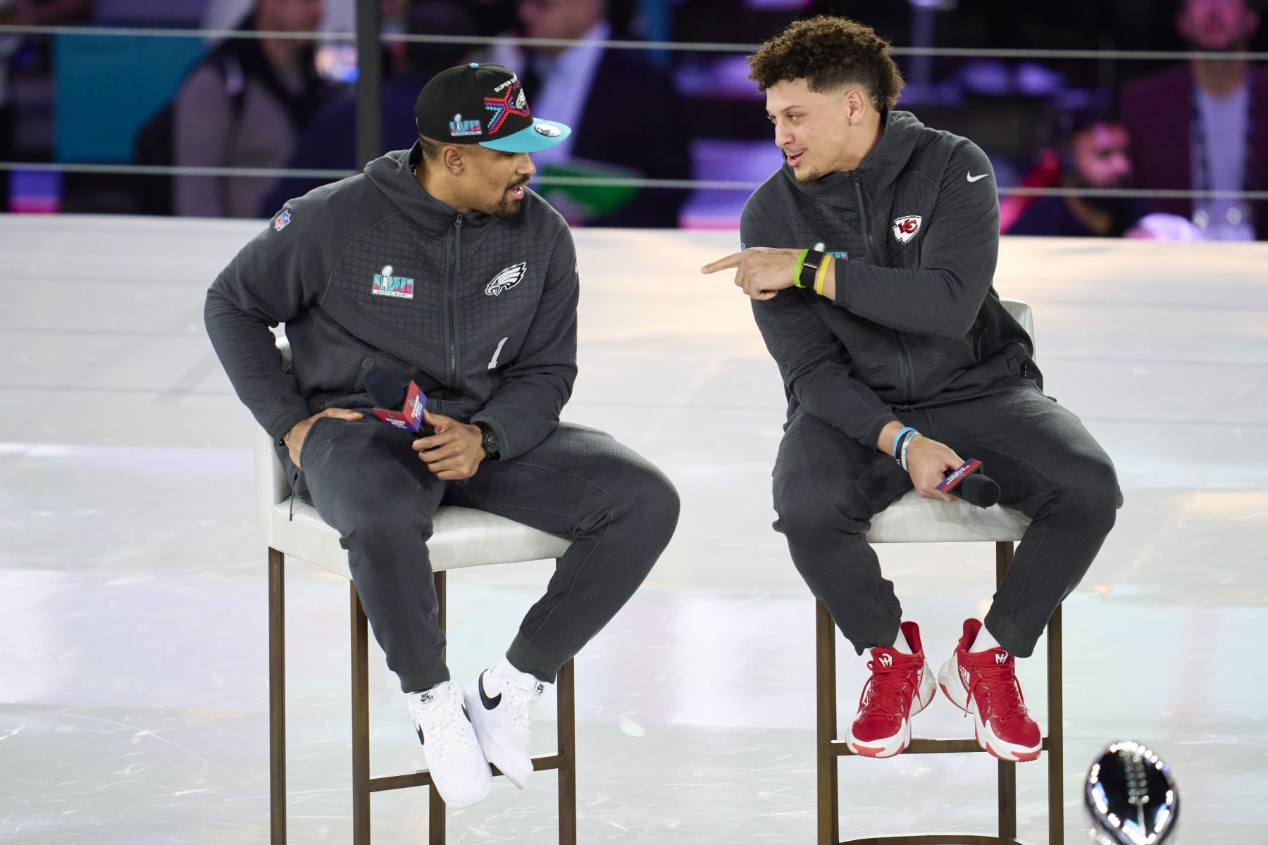 PHOENIX, AZ - FEBRUARY 06: Jalen Hurts #1 of the Philadelphia Eagles speaks with Patrick Mahomes #15 of the Kansas City Chiefs at Footprint Center on February 6, 2023 in Phoenix, Arizona. (Photo by Cooper Neill/Getty Images)