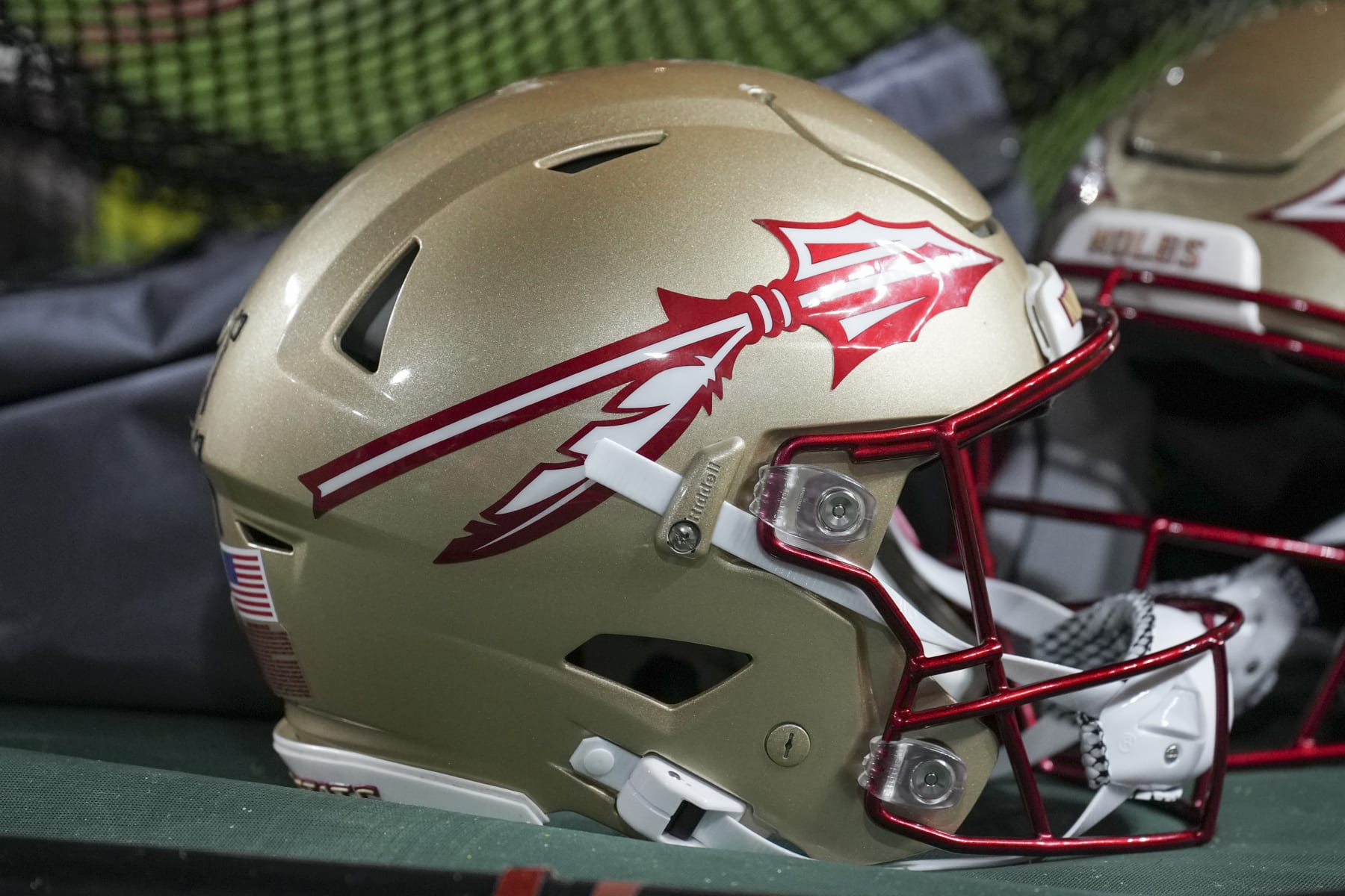 MIAMI GARDENS, FL - NOVEMBER 05: An Florida State Seminoles helmet rests not he sidelines during the game between the Florida State Seminoles and the Miami Hurricanes on Saturday, November 5, 2022 at Hard Rock Stadium, Miami Gardens, FL (Photo by Peter Joneleit/Icon Sportswire via Getty Images)
