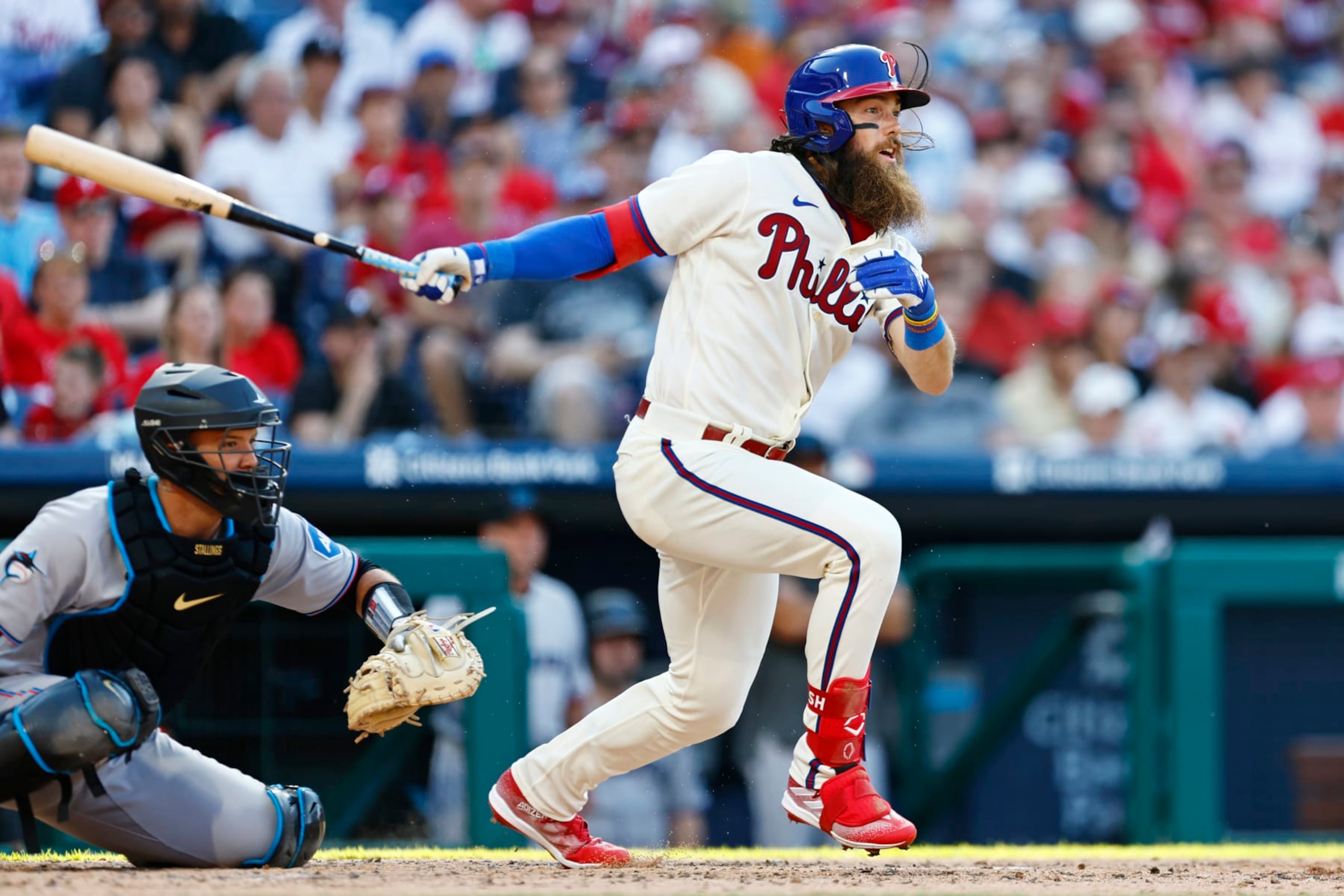 PHILADELPHIA, PA - APRIL 12: Brandon Marsh #16 of the Philadelphia Phillies hits an RBI single against the Miami Marlins during the fourth inning of a game at Citizens Bank Park on April 12, 2023 in Philadelphia, Pennsylvania. (Photo by Rich Schultz/Getty Images)