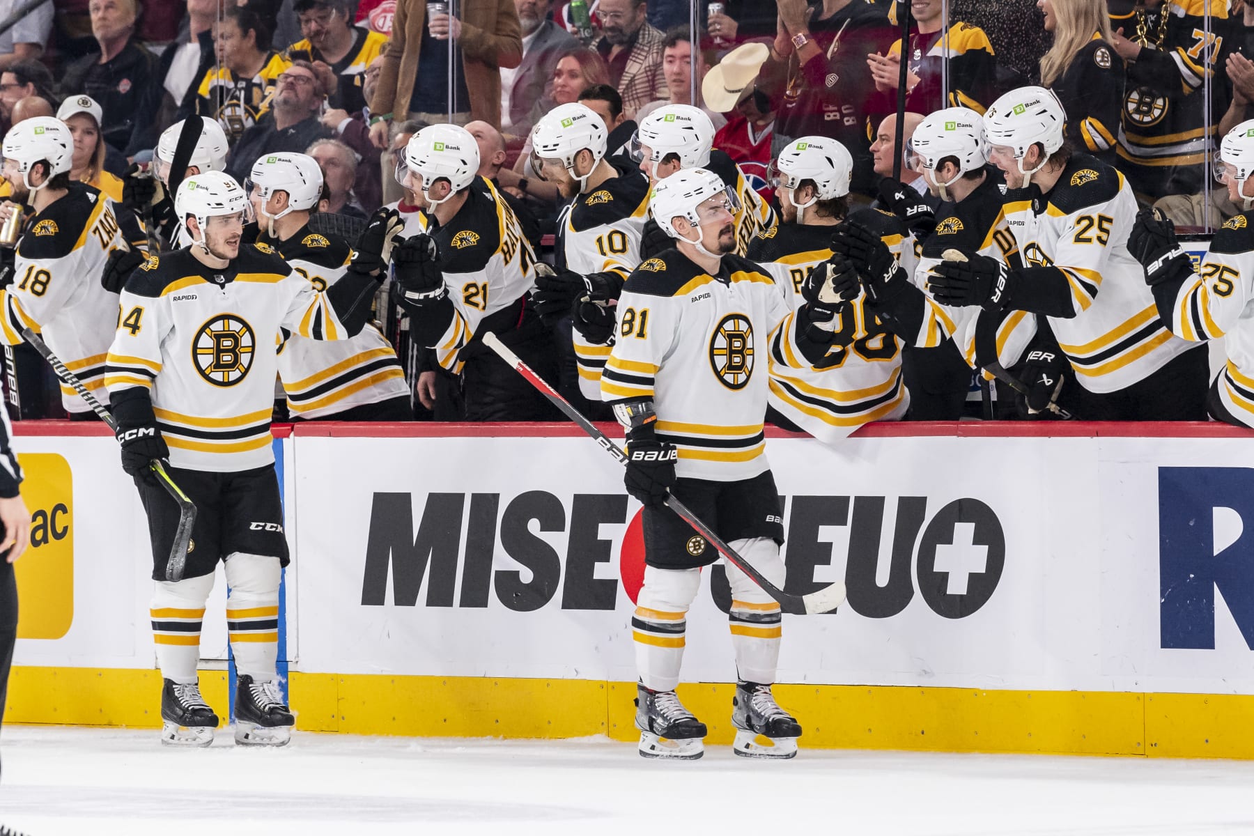 MONTREAL, CANADA - APRIL 13: Dmitry Orlov #81 of the Boston Bruins celebrates a goal with the bench during the second period of the NHL regular season game between the Montreal Canadiens and the Boston Bruins at the Bell Centre on April 13, 2023 in Montreal, Quebec, Canada. (Photo by Francois Lacasse/NHLI via Getty Images)