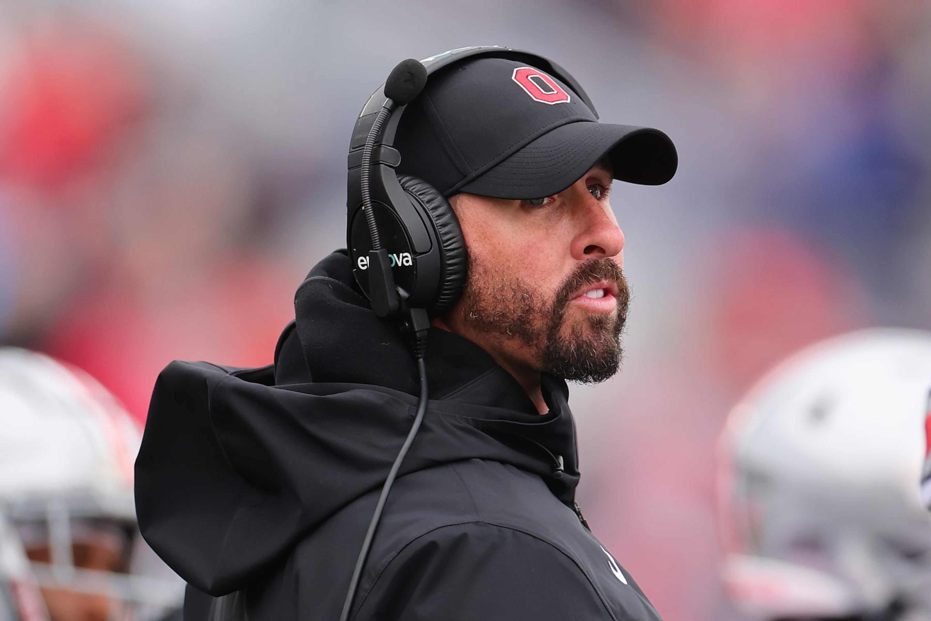EVANSTON, ILLINOIS - NOVEMBER 05: Wide receiver coach Brian Hartline of the Ohio State Buckeyes looks on against the Northwestern Wildcats during the second half at Ryan Field on November 05, 2022 in Evanston, Illinois. (Photo by Michael Reaves/Getty Images) EVANSTON, ILLINOIS - NOVEMBER 05: Wide receiver coach Brian Hartline of the Ohio State Buckeyes looks on against the Northwestern Wildcats during the second half at Ryan Field on November 05, 2022 in Evanston, Illinois. (Photo by Michael Reaves/Getty Images)