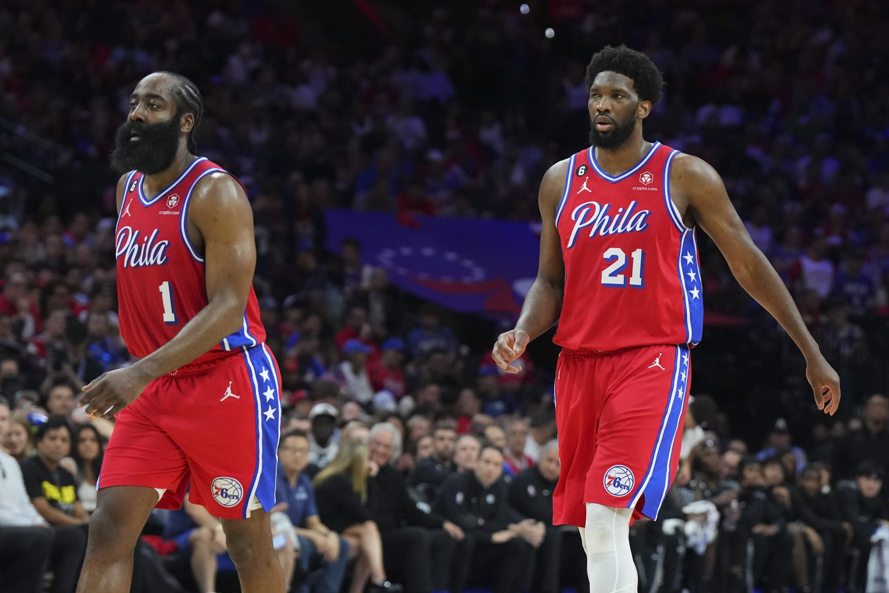 PHILADELPHIA, PA - APRIL 15: James Harden #1 and Joel Embiid #21 of the Philadelphia 76ers look on against the Brooklyn Nets during Game One of the Eastern Conference First Round Playoffs at the Wells Fargo Center on April 15, 2023 in Philadelphia, Pennsylvania. The 76ers defeated the Nets 121-101. NOTE TO USER: User expressly acknowledges and agrees that, by downloading and or using this photograph, User is consenting to the terms and conditions of the Getty Images License Agreement. (Photo by Mitchell Leff/Getty Images)