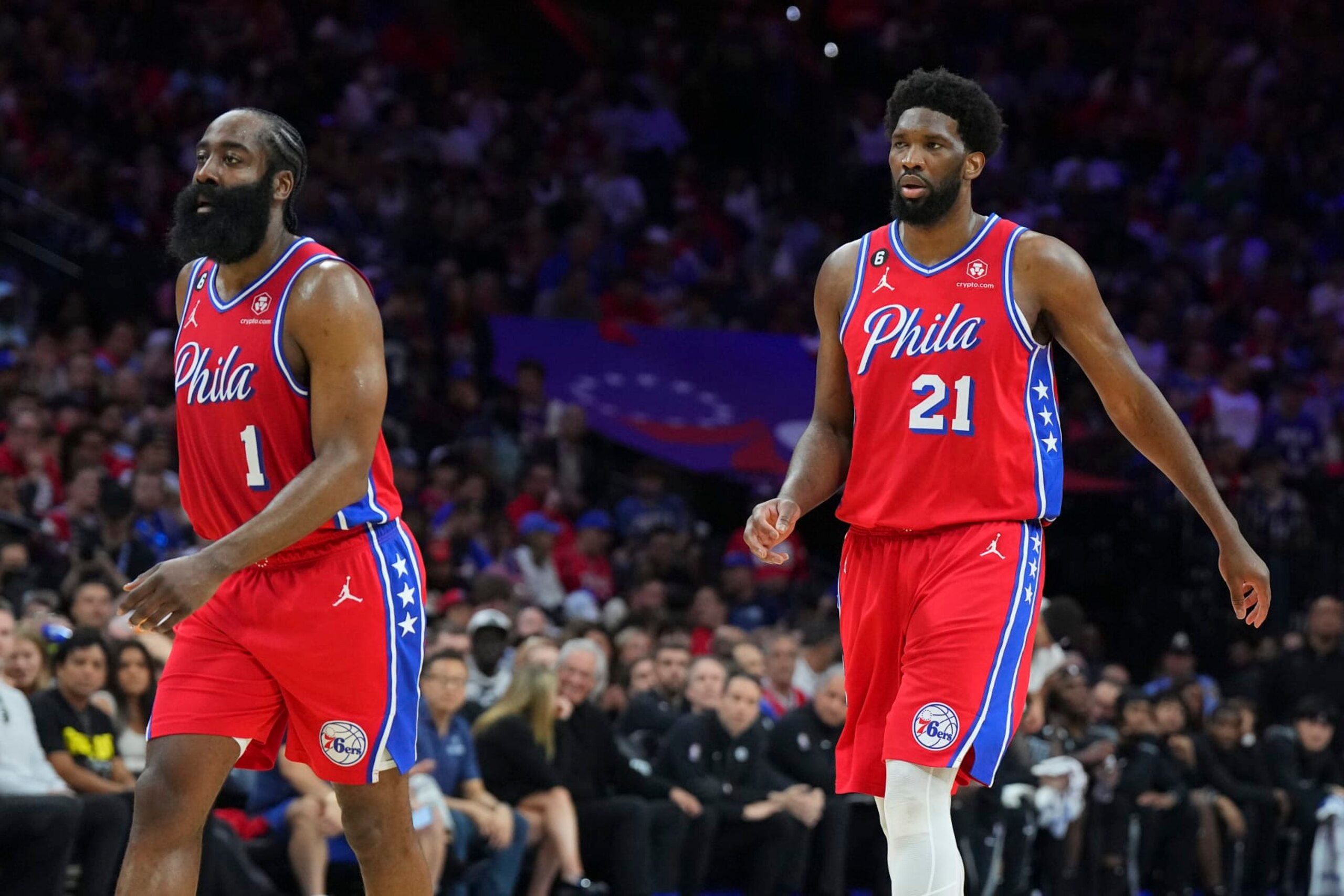 PHILADELPHIA, PA - APRIL 15: James Harden #1 and Joel Embiid #21 of the Philadelphia 76ers look on against the Brooklyn Nets during Game One of the Eastern Conference First Round Playoffs at the Wells Fargo Center on April 15, 2023 in Philadelphia, Pennsylvania. The 76ers defeated the Nets 121-101. NOTE TO USER: User expressly acknowledges and agrees that, by downloading and or using this photograph, User is consenting to the terms and conditions of the Getty Images License Agreement. (Photo by Mitchell Leff/Getty Images)