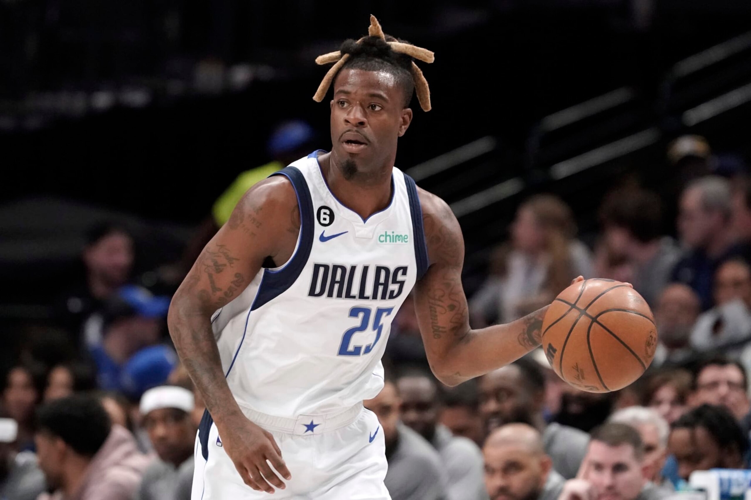 DALLAS, TEXAS - MARCH 13: Reggie Bullock #25 of the Dallas Mavericks controls the ball during the first half of the game against the Memphis Grizzlies at American Airlines Center on March 13, 2023 in Dallas, Texas. NOTE TO USER: User expressly acknowledges and agrees that, by downloading and/or using this Photograph, user is consenting to the terms and conditions of the Getty Images License Agreement. (Photo by Sam Hodde/Getty Images)