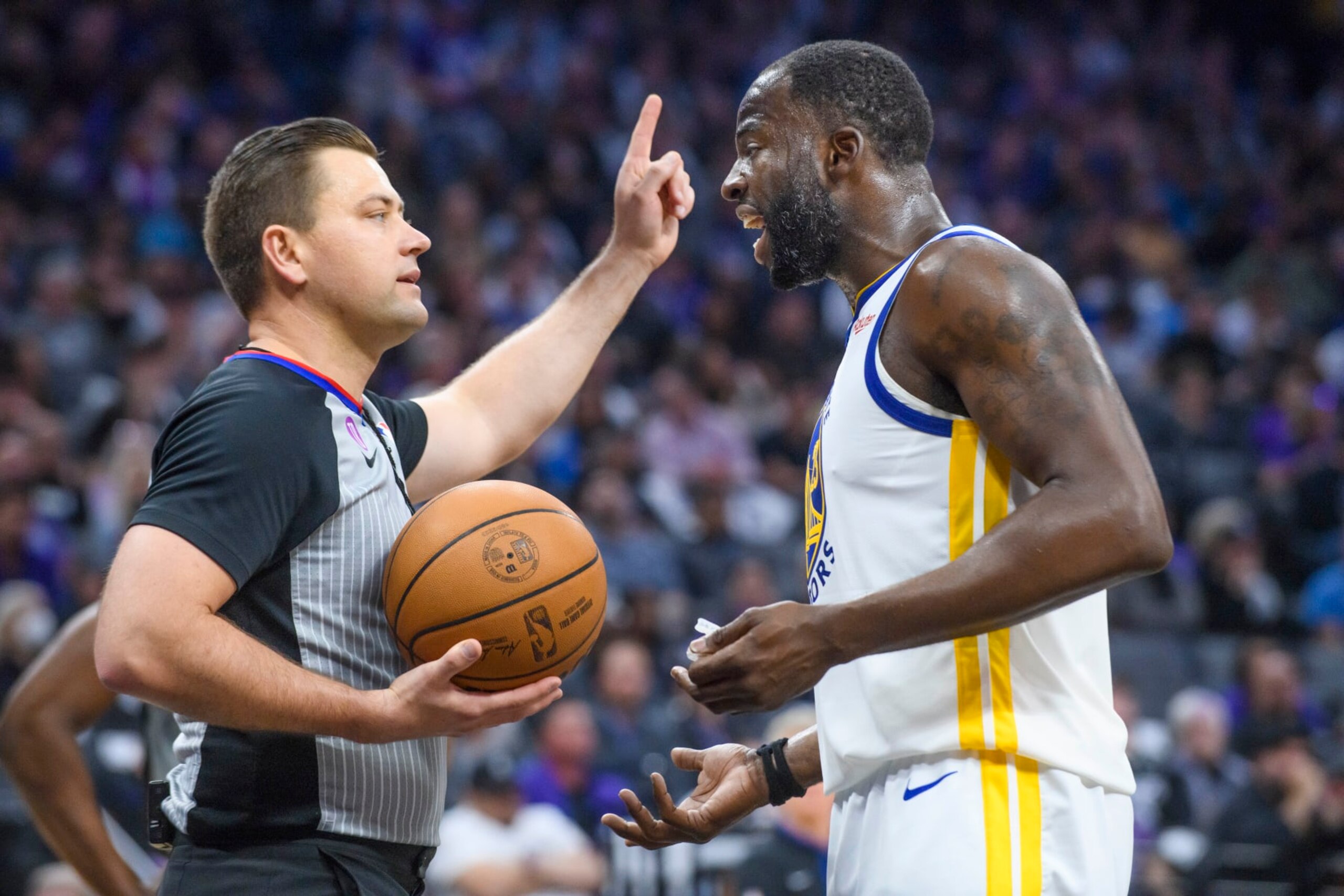 Golden State Warriors forward Draymond Green, right, argues with referee Gediminas Petraitis in the first half during Game 1 in the first round of the NBA basketball playoffs against the Sacramento Kings in Sacramento, Calif., Monday, April 17, 2023. (AP Photo/Randall Benton)