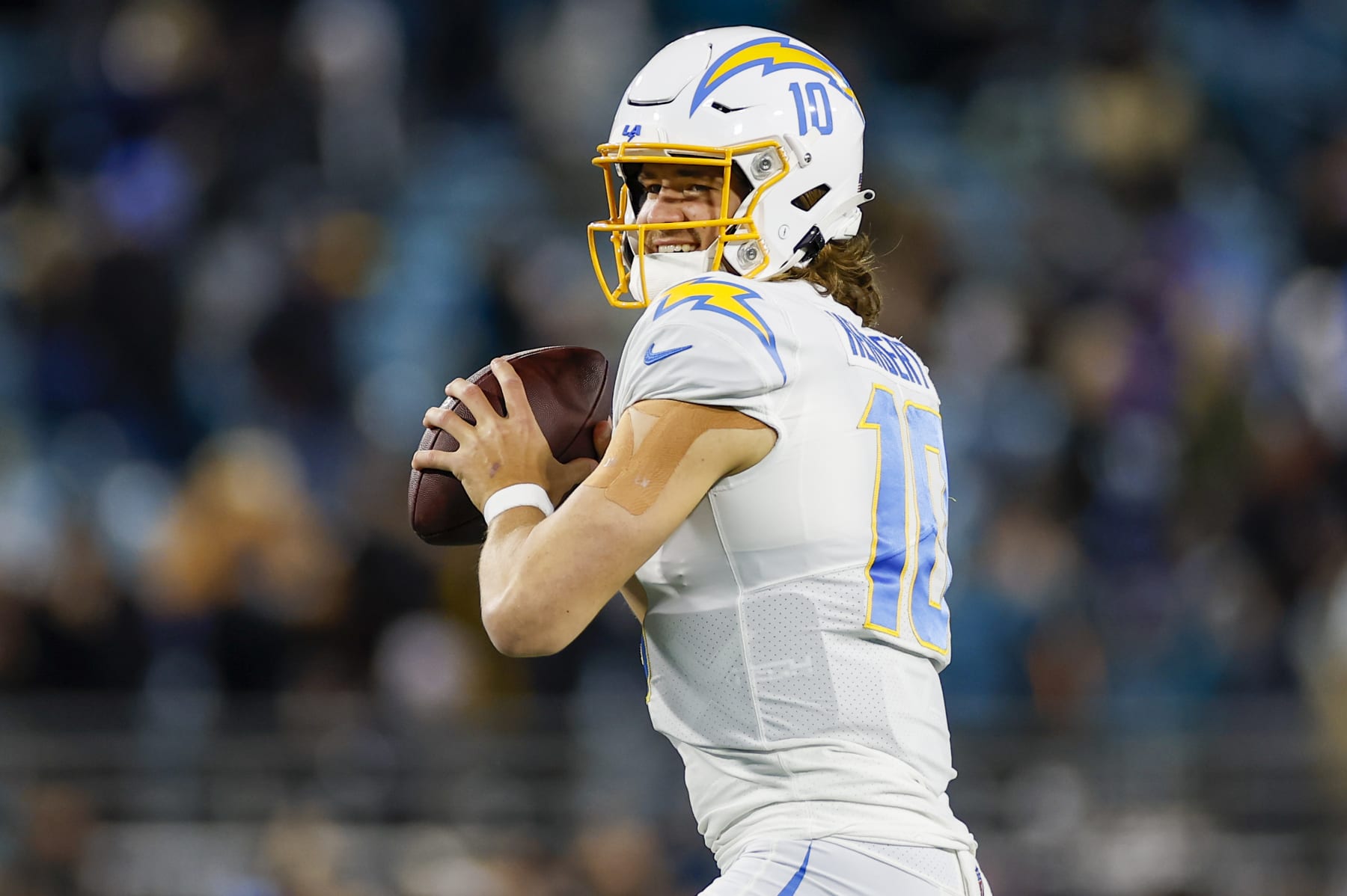 JACKSONVILLE, FL - JANUARY 14: Los Angeles Chargers quarterback Justin Herbert (10) throws a pass during the game between the Los Angeles Chargers and the Jacksonville Jaguars on January 14, 2023 at TIAA Bank Field in Jacksonville, Fl. (Photo by David Rosenblum/Icon Sportswire via Getty Images)