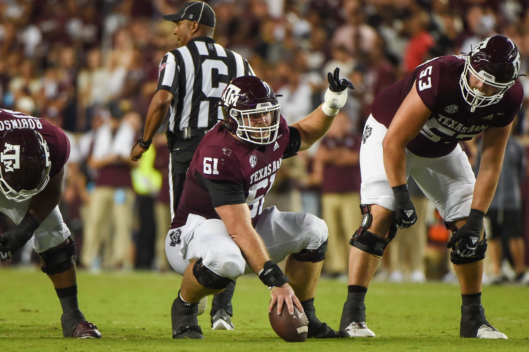 COLLEGE STATION, TX - OCTOBER 09: Texas A&M Aggies offensive lineman Bryce Foster (61) calls out blocking assignments before the snap during a game between the Alabama Crimson Tide and the Texas A&M Aggies at Kyle Field on October 9, 2021 in College Station, Texas. (Photo by Ken Murray/Icon Sportswire via Getty Images)