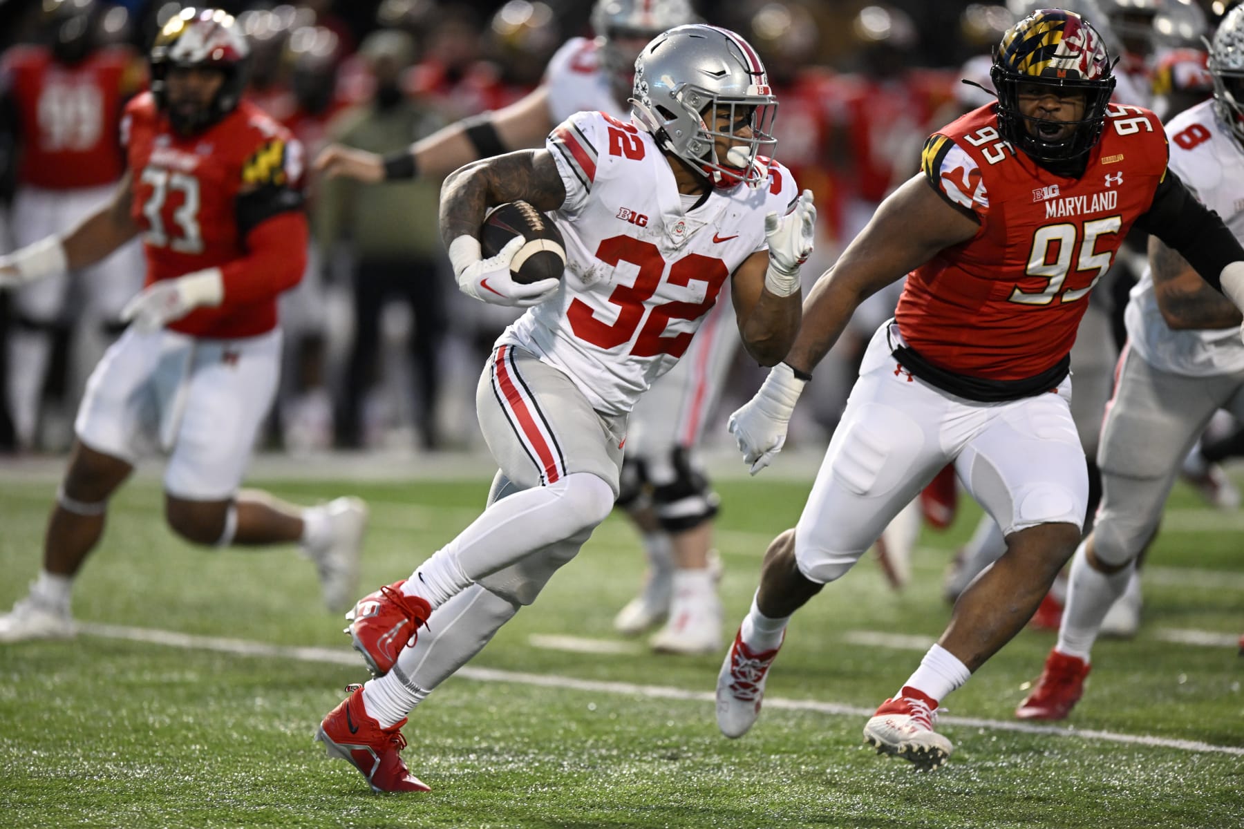 COLLEGE PARK, MARYLAND - NOVEMBER 19: TreVeyon Henderson #32 of the Ohio State Buckeyes rushes the ball in the second quarter against the Maryland Terrapins at SECU Stadium on November 19, 2022 in College Park, Maryland. (Photo by Greg Fiume/Getty Images)
