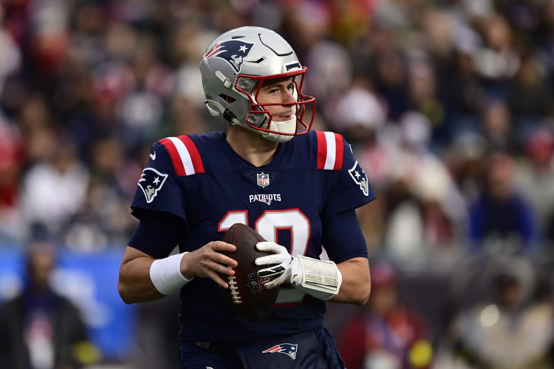 FOXBOROUGH, MASSACHUSETTS - JANUARY 01: Mac Jones #10 of the New England Patriots looks to throw against the Miami Dolphins at Gillette Stadium on January 01, 2023 in Foxborough, Massachusetts. (Photo by Billie Weiss/Getty Images)