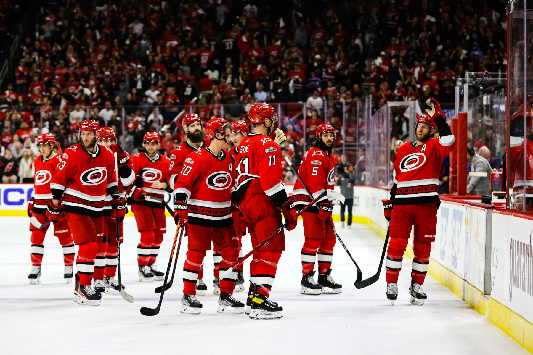 RALEIGH, NC - APRIL 17: The Carolina Hurricanes celebrate their win against the New York Islanders after the third period of Eastern Conference Game One of the First Round of the 2023 Stanley Cup Playoffs at PNC Arena on April 17, 2023 in Raleigh, North Carolina. Hurricanes defeat Islanders 2-1. (Photo by Jaylynn Nash/Getty Images)