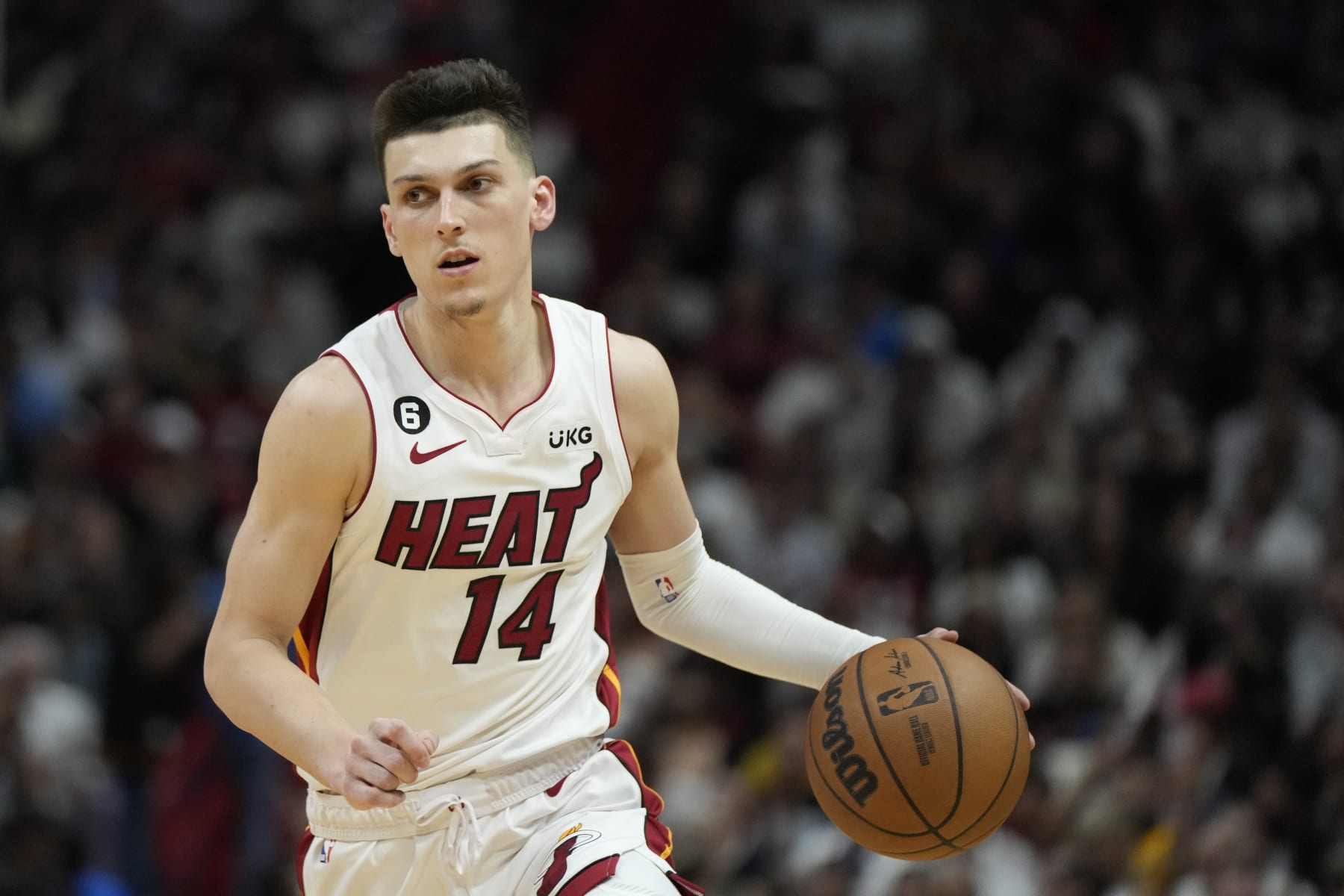 Miami Heat guard Tyler Herro (14) dribbles the ball during the second half of an NBA basketball play-in tournament game against the Atlanta Hawks, Tuesday, April 11, 2023, in Miami. (AP Photo/Rebecca Blackwell)