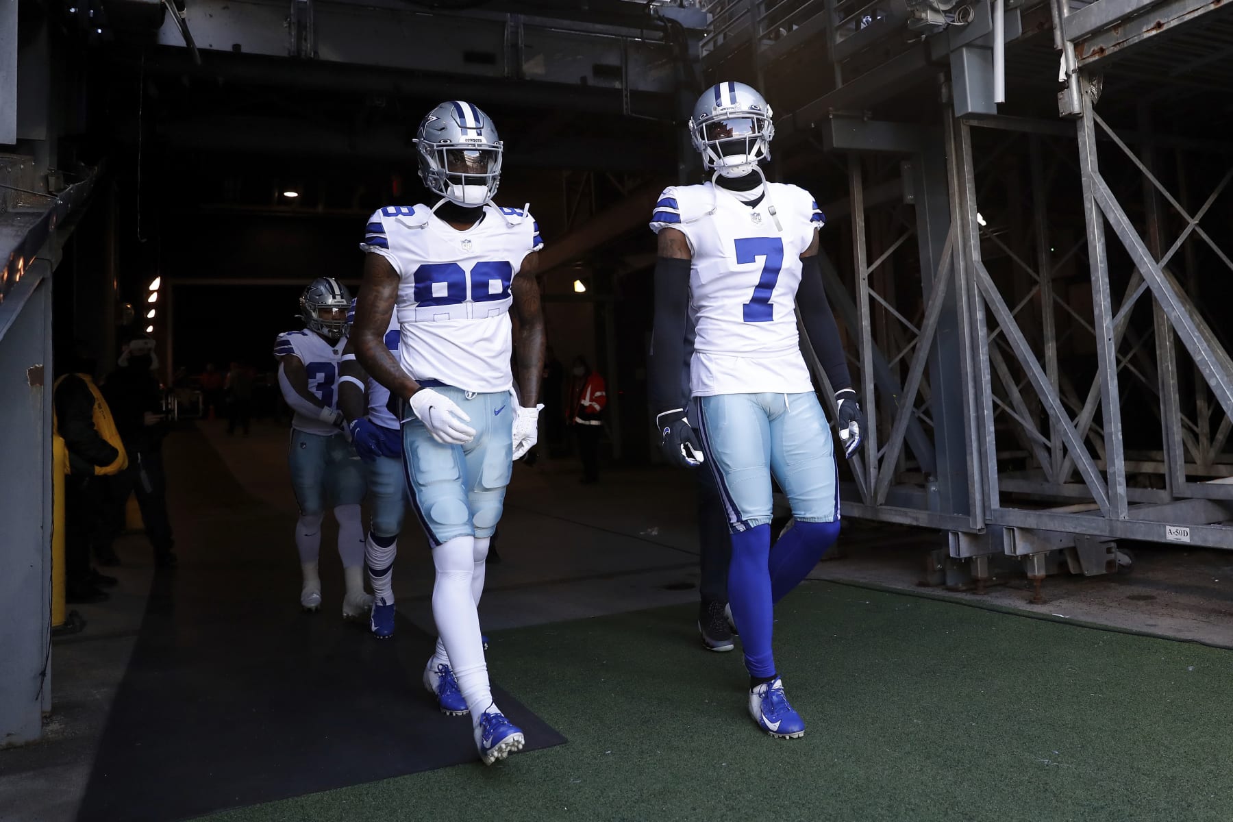 Dallas Cowboys wide receiver CeeDee Lamb (88) and Dallas Cowboys cornerback Trevon Diggs (7) walk out onto the field before an NFL football game against the New York Giants, Sunday, Dec. 19, 2021, in East Rutherford, N.J. The Dallas Cowboys defeated the New York Giants 21-6. (AP Photo/Steve Luciano)