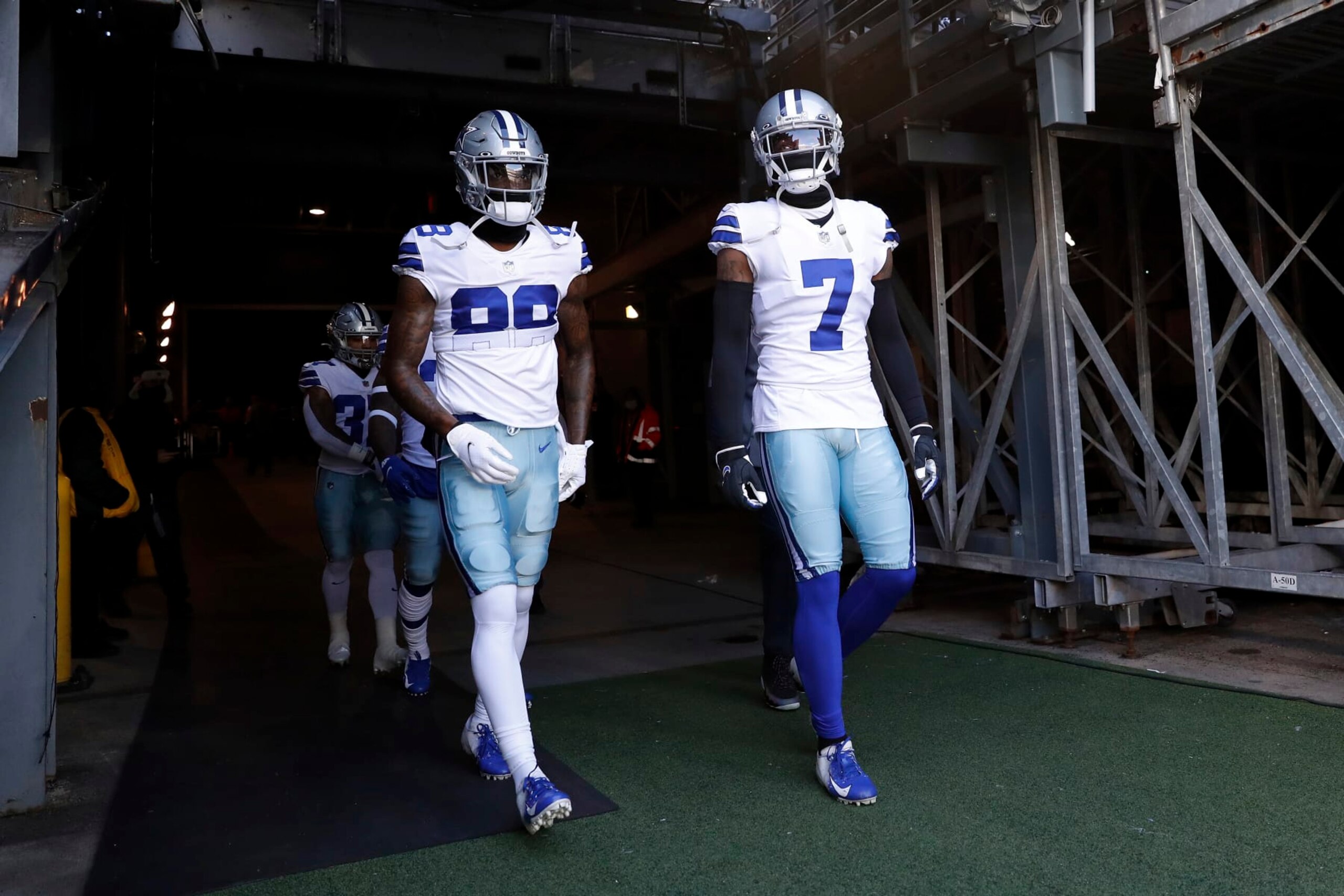 Dallas Cowboys wide receiver CeeDee Lamb (88) and Dallas Cowboys cornerback Trevon Diggs (7) walk out onto the field before an NFL football game against the New York Giants, Sunday, Dec. 19, 2021, in East Rutherford, N.J. The Dallas Cowboys defeated the New York Giants 21-6. (AP Photo/Steve Luciano)