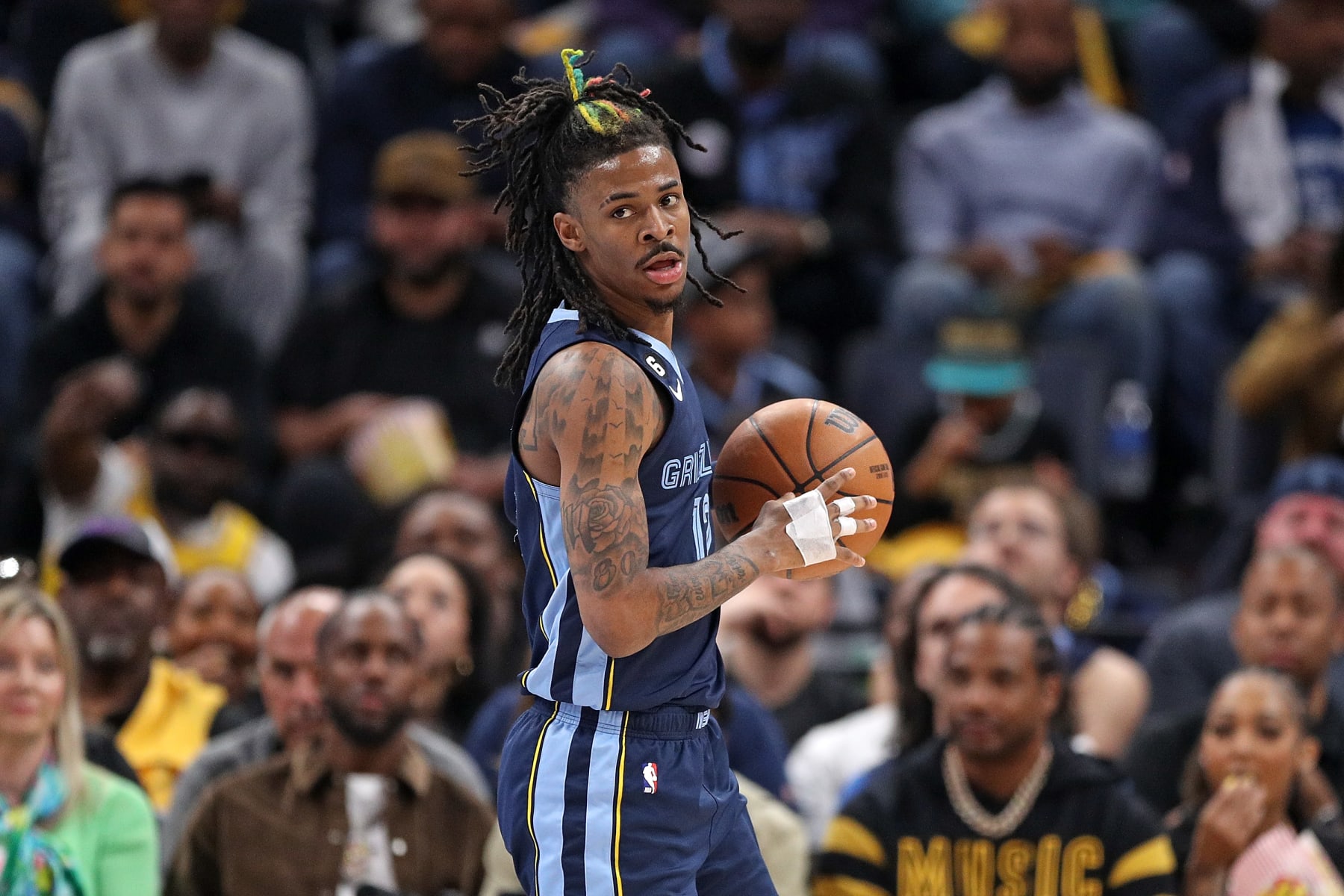MEMPHIS, TENNESSEE - APRIL 16: Ja Morant #12 of the Memphis Grizzlies brings the ball up court during the game against the Los Angeles Lakers during Game One of the Western Conference First Round Playoffs at FedExForum on April 16, 2023 in Memphis, Tennessee. NOTE TO USER: User expressly acknowledges and agrees that, by downloading and or using this photograph, User is consenting to the terms and conditions of the Getty Images License Agreement.  (Photo by Justin Ford/Getty Images)