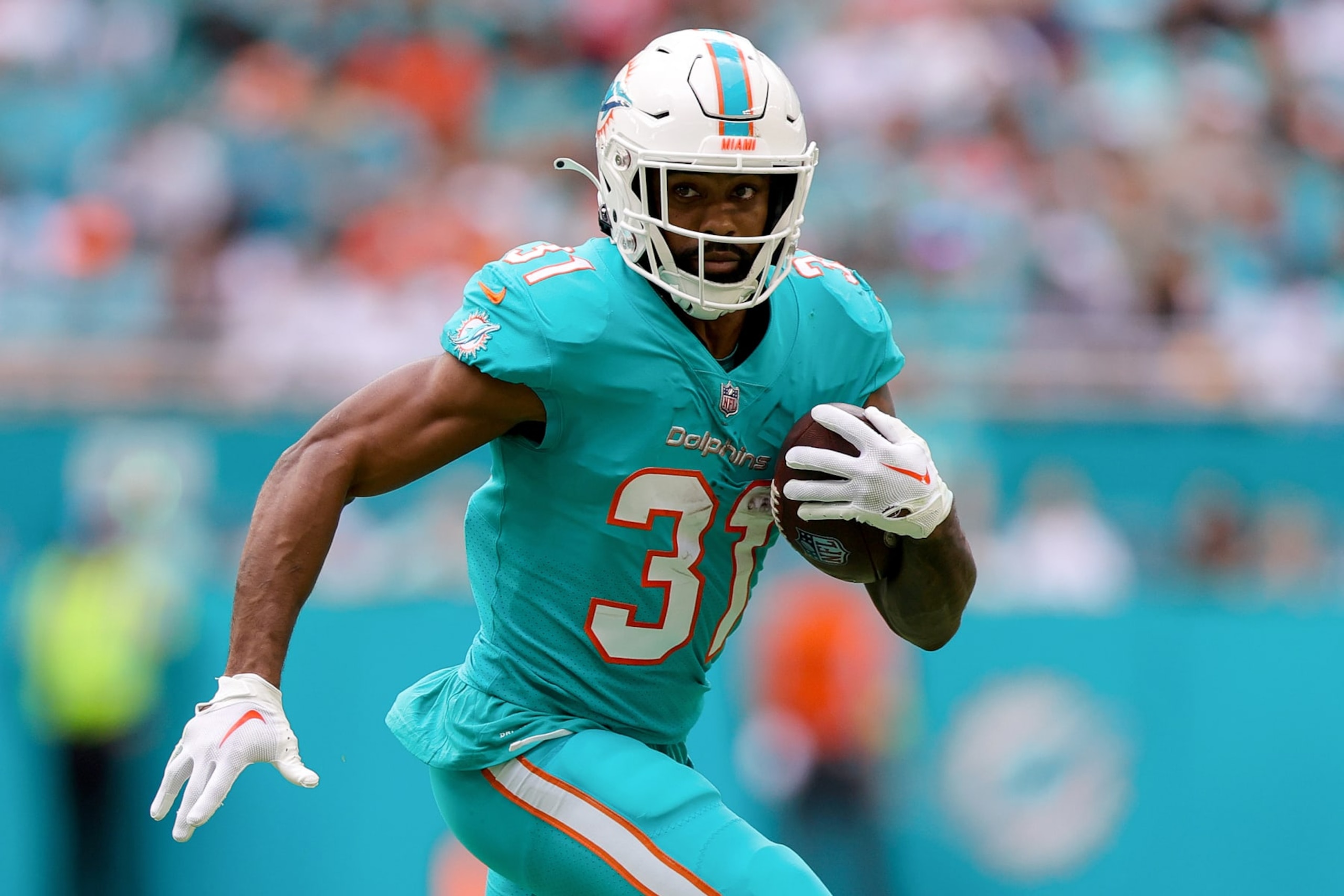 MIAMI GARDENS, FLORIDA - JANUARY 08: Raheem Mostert #31 of the Miami Dolphins carries the ball against the New York Jets during the first half of the game at Hard Rock Stadium on January 08, 2023 in Miami Gardens, Florida. (Photo by Megan Briggs/Getty Images)