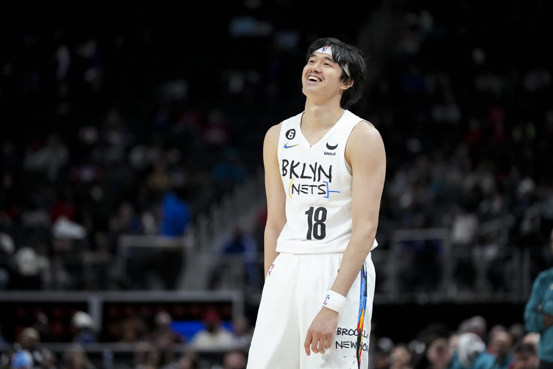 DETROIT, MICHIGAN - APRIL 05: Yuta Watanabe #18 of the Brooklyn Nets looks on and smiles against the Detroit Pistons at Little Caesars Arena on April 05, 2023 in Detroit, Michigan. NOTE TO USER: User expressly acknowledges and agrees that, by downloading and or using this photograph, User is consenting to the terms and conditions of the Getty Images License Agreement. (Photo by Nic Antaya/Getty Images)