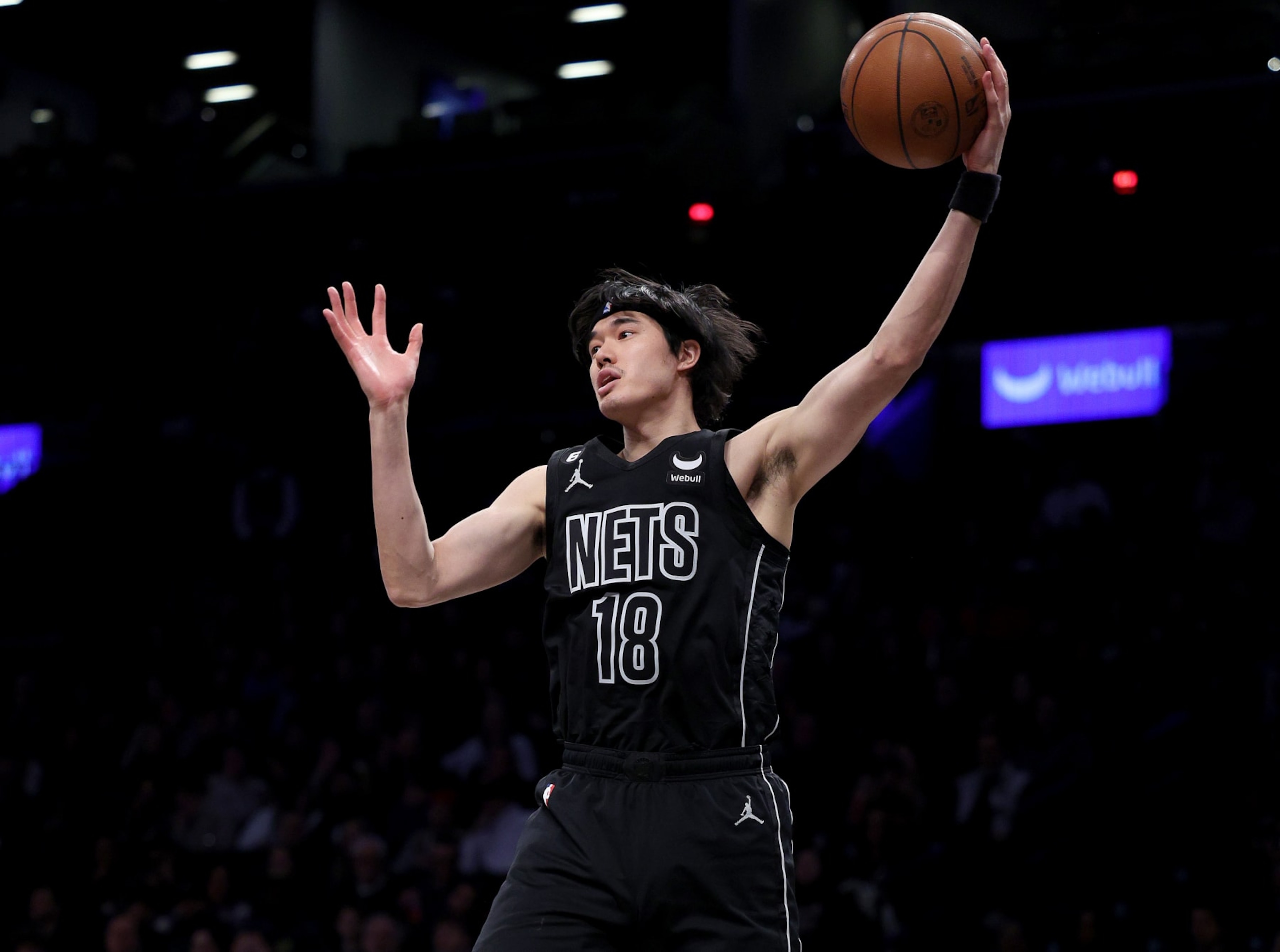 NEW YORK, NEW YORK - APRIL 07:  Yuta Watanabe #18 of the Brooklyn Nets grabs the rebound in the fourth quarter against the Orlando Magic at Barclays Center on April 07, 2023 in the Brooklyn borough of New York City. NOTE TO USER: User expressly acknowledges and agrees that, by downloading and or using this photograph, User is consenting to the terms and conditions of the Getty Images License Agreement. (Photo by Elsa/Getty Images)