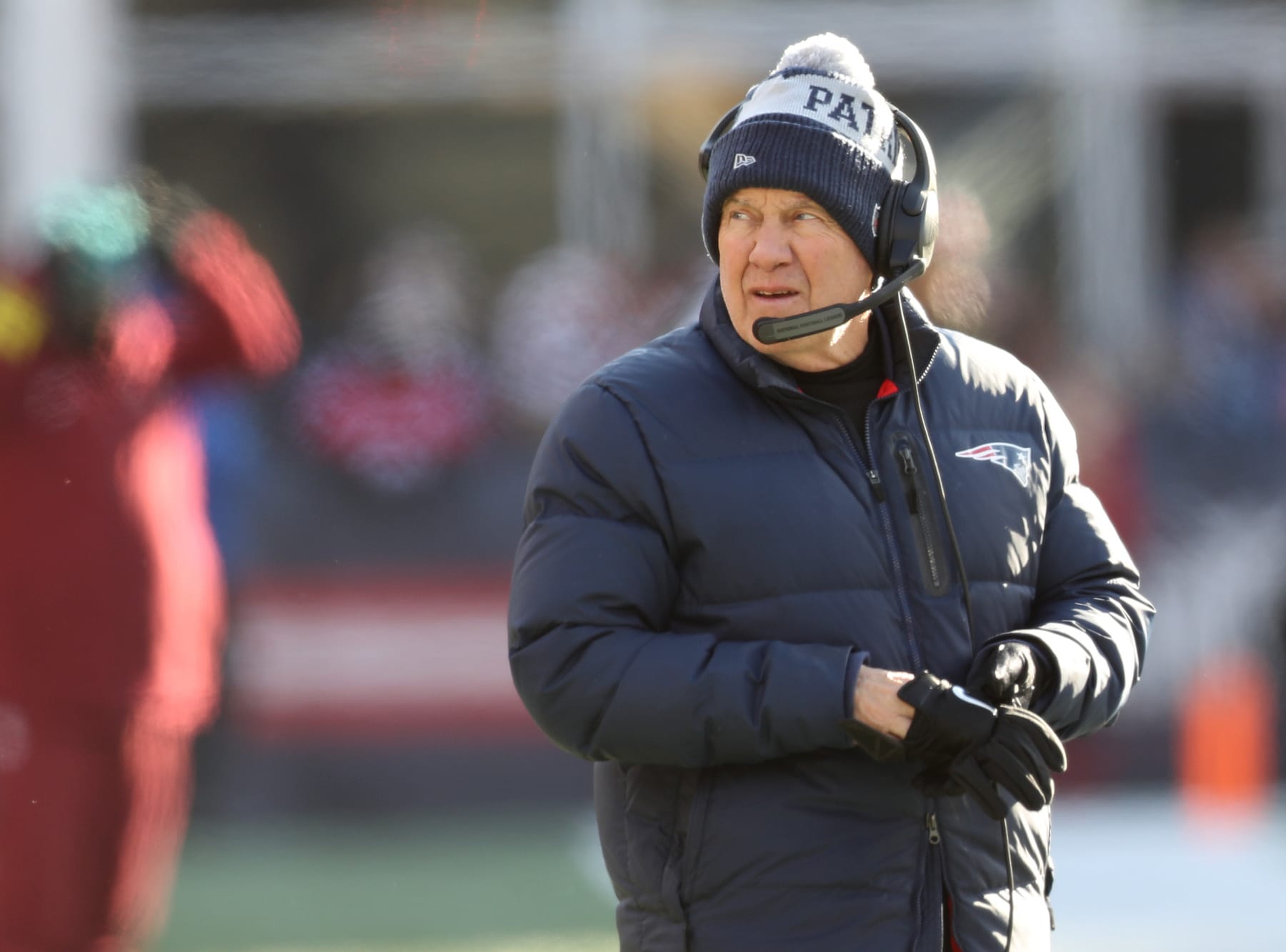 Foxborough, MA - December 24: New England Patriots head coach Bill Belichick puts his gloves on in the first quarter. The Patriots lost to the Cincinnati Bengals, 22-18. (Photo by John Tlumacki/The Boston Globe via Getty Images)