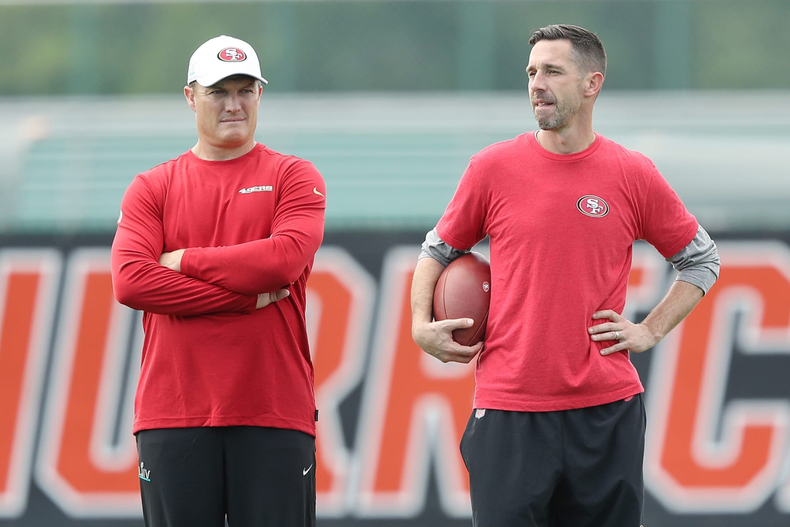 CORAL GABLES, FLORIDA - JANUARY 29:  Head coach Kyle Shanahan of the San Francisco 49ers (R) talks with general manager John Lynch during practice for Super Bowl LIV at the Greentree Practice Fields on the campus of the University of Miami on January 29, 2020 in Coral Gables, Florida. (Photo by Michael Reaves/Getty Images)