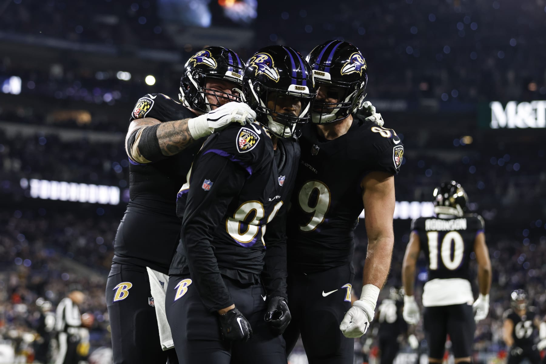 BALTIMORE, MARYLAND - JANUARY 01: Isaiah Likely #80 of the Baltimore Ravens celebrates with his teammates Ben Powers #72 of the Baltimore Ravens and Mark Andrews #89 of the Baltimore Ravens after scoring a touchdown during an NFL football game between the Baltimore Ravens and the Pittsburgh Steelers at M&T Bank Stadium on January 01, 2023 in Baltimore, Maryland. (Photo by Michael Owens/Getty Images)