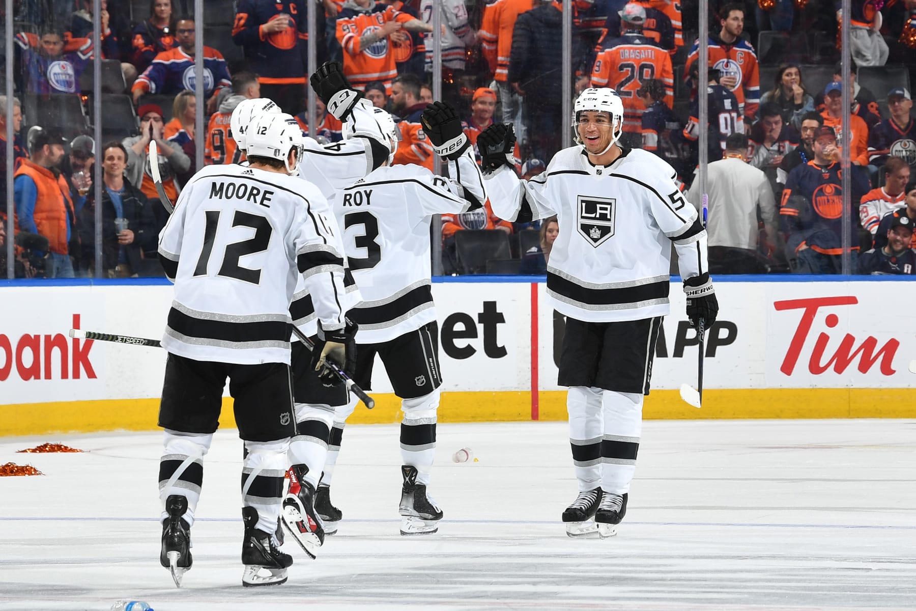 EDMONTON, CANADA - APRIL 17: Trevor Moore #12, Quinton Byfield #55, Matt Roy #3 and Mikey Anderson #44 of the Los Angeles Kings celebrate after beating the Edmonton Oilers in overtime after Game One of the First Round of the 2023 Stanley Cup Playoffs at Rogers Place on April 17, 2023, in Edmonton, Alberta, Canada. (Photo by Andy Devlin/NHLI via Getty Images)
