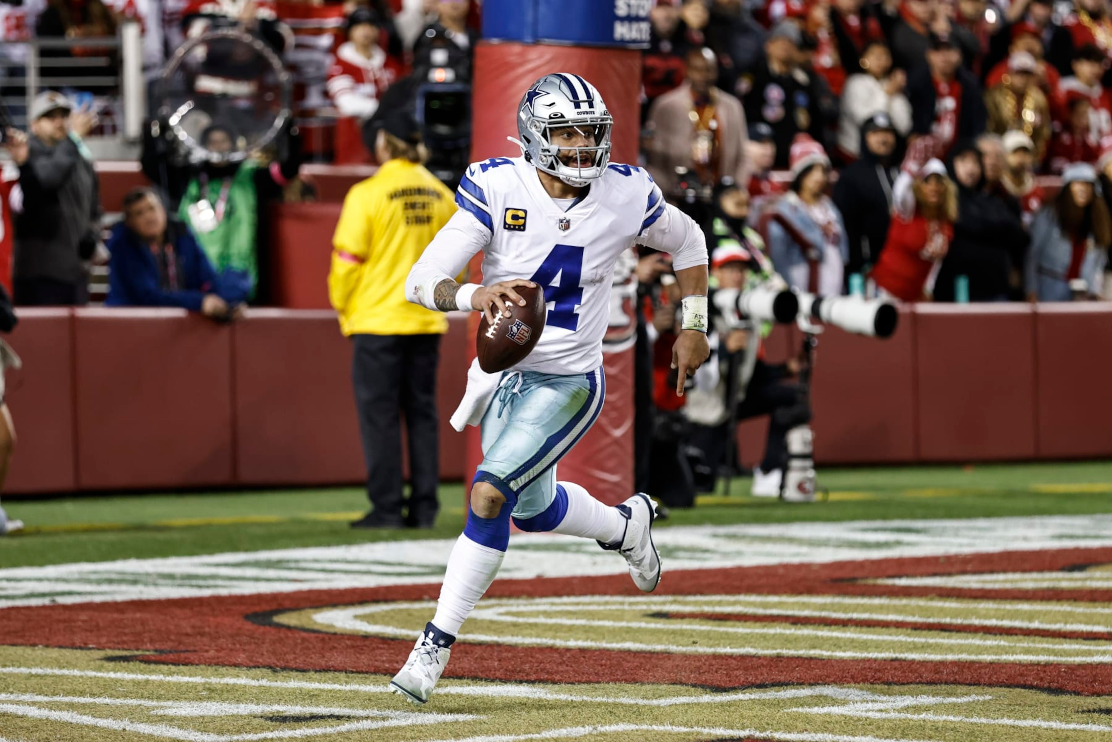 SANTA CLARA, CALIFORNIA - JANUARY 22: Dak Prescott #4 of the Dallas Cowboys scrambles and runs with the ball during an NFL divisional round playoff football game between the San Francisco 49ers and the Dallas Cowboys at Levi's Stadium on January 22, 2023 in Santa Clara, California. (Photo by Michael Owens/Getty Images) SANTA CLARA, CALIFORNIA - JANUARY 22: Dak Prescott #4 of the Dallas Cowboys scrambles and runs with the ball during an NFL divisional round playoff football game between the San Francisco 49ers and the Dallas Cowboys at Levi's Stadium on January 22, 2023 in Santa Clara, California. (Photo by Michael Owens/Getty Images)