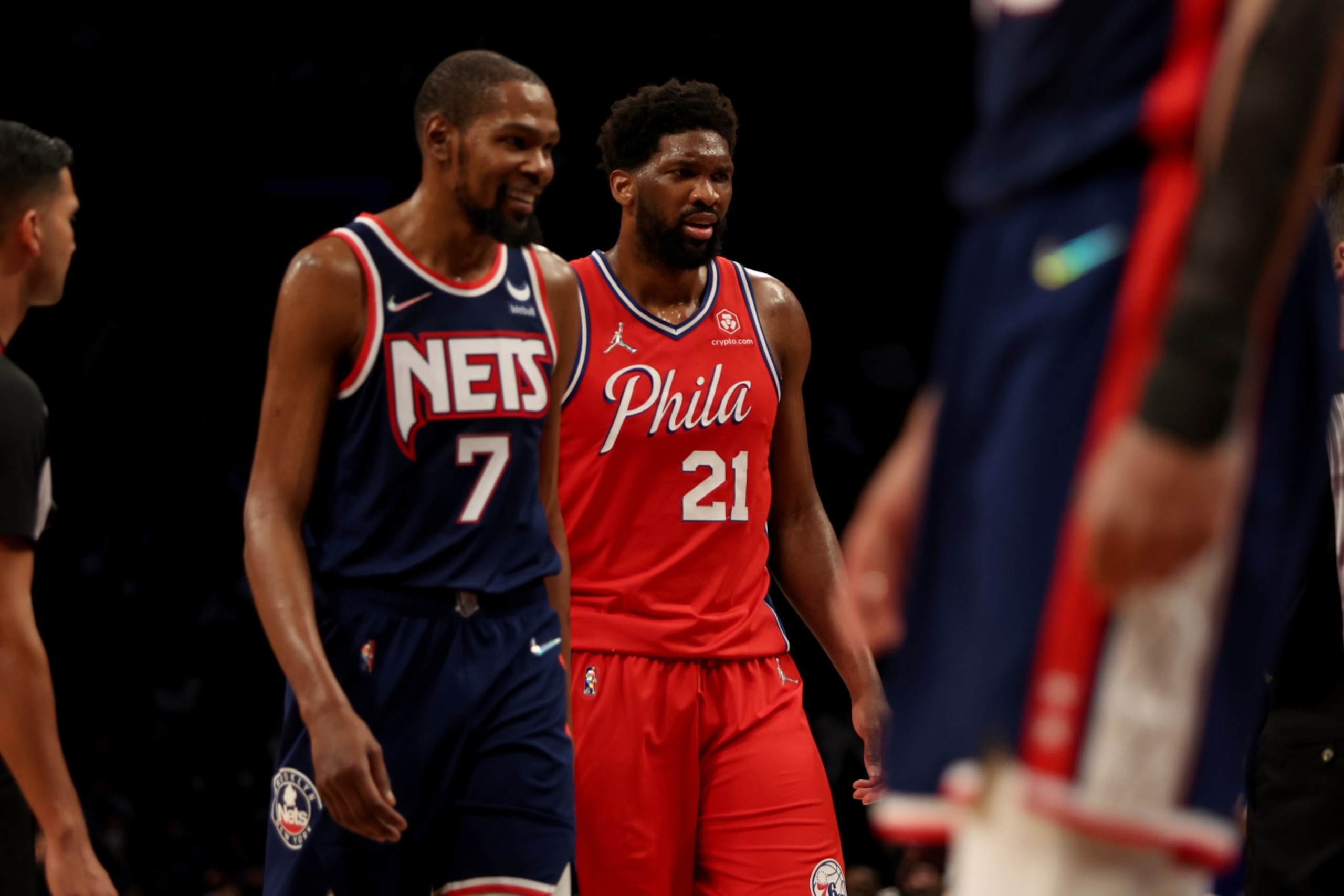 NEW YORK, NEW YORK - DECEMBER 30: Joel Embiid #21 of the Philadelphia 76ers prepares to shoot a free throw as Kevin Durant #7 of the Brooklyn Nets looks on during the fourth quarter at Barclays Center on December 30, 2021 in New York City. NOTE TO USER: User expressly acknowledges and agrees that, by downloading and or using this photograph, User is consenting to the terms and conditions of the Getty Images License Agreement. (Photo by Dustin Satloff/Getty Images)