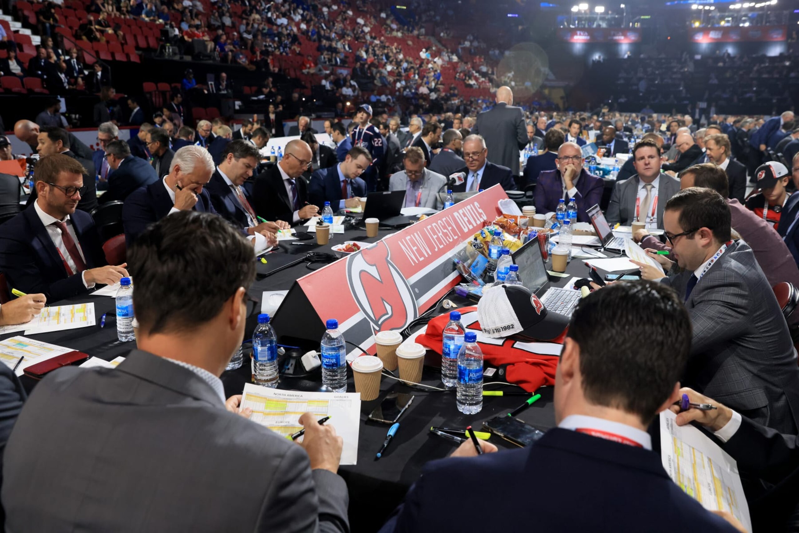 MONTREAL, QUEBEC - JULY 08: The New Jersey Devils draft table during Round Three of the 2022 Upper Deck NHL Draft at Bell Centre on July 08, 2022 in Montreal, Quebec, Canada. (Photo by Bruce Bennett/Getty Images) MONTREAL, QUEBEC - JULY 08: The New Jersey Devils draft table during Round Three of the 2022 Upper Deck NHL Draft at Bell Centre on July 08, 2022 in Montreal, Quebec, Canada. (Photo by Bruce Bennett/Getty Images)