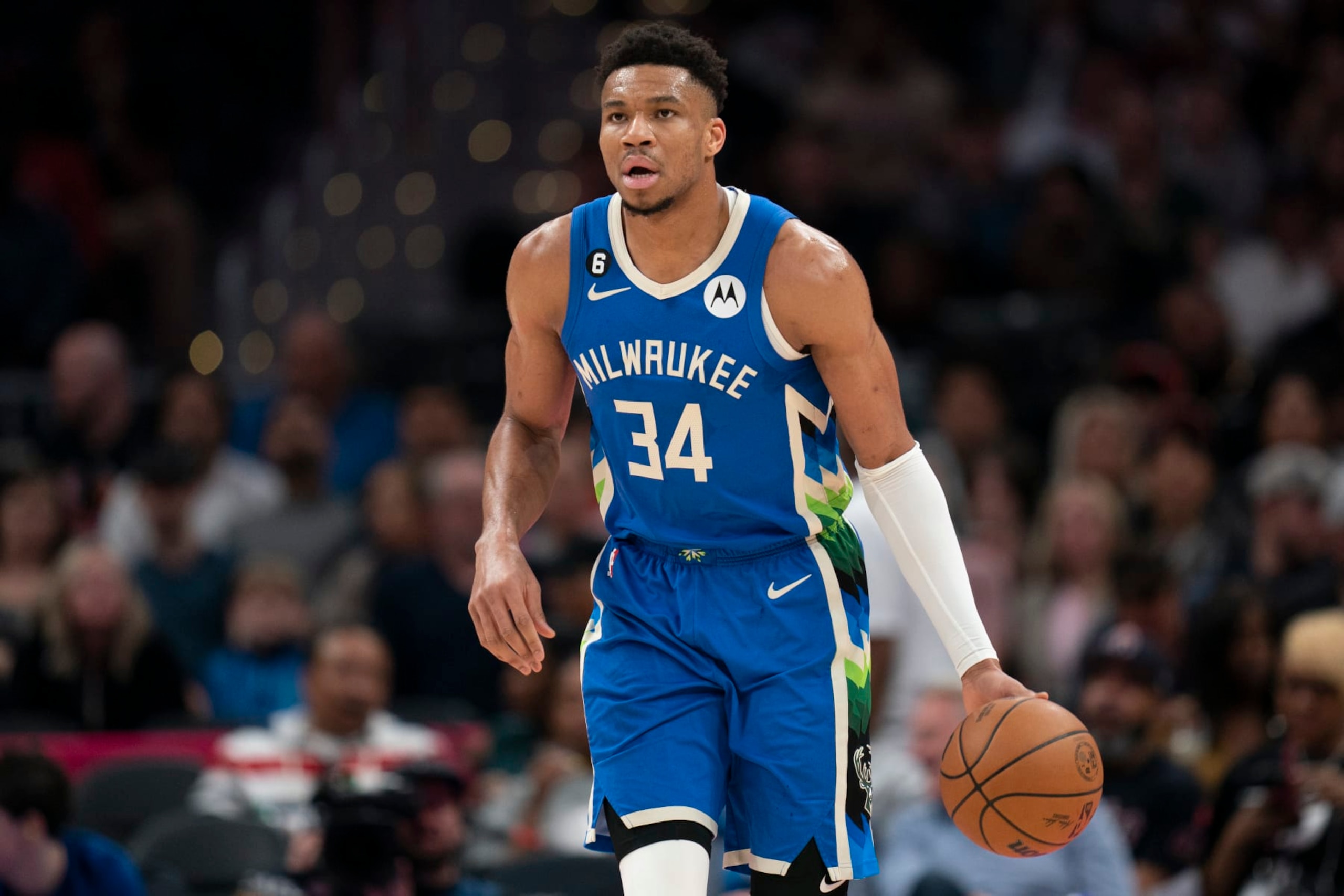 Milwaukee Bucks forward Giannis Antetokounmpo (34) dribbles during the first half of an NBA basketball game against the Washington Wizards, Tuesday, April 4, 2023, in Washington. (AP Photo/Jess Rapfogel)