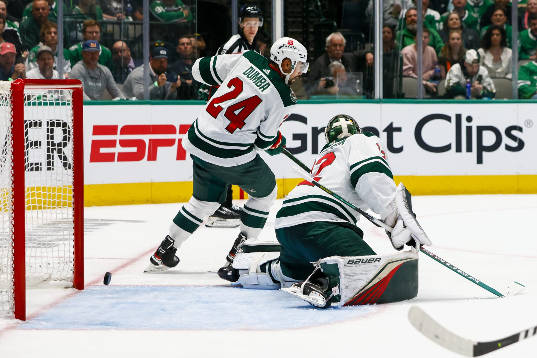 DALLAS, TX - APRIL 17: Minnesota Wild defenseman Matt Dumba (24) and goaltender Filip Gustavsson (32) miss the puck as it hits the posts during the game between the Dallas Stars and the Minnesota Wild on April 17, 2023 at American Airlines Center in Dallas, Texas. (Photo by Matthew Pearce/Icon Sportswire via Getty Images)
