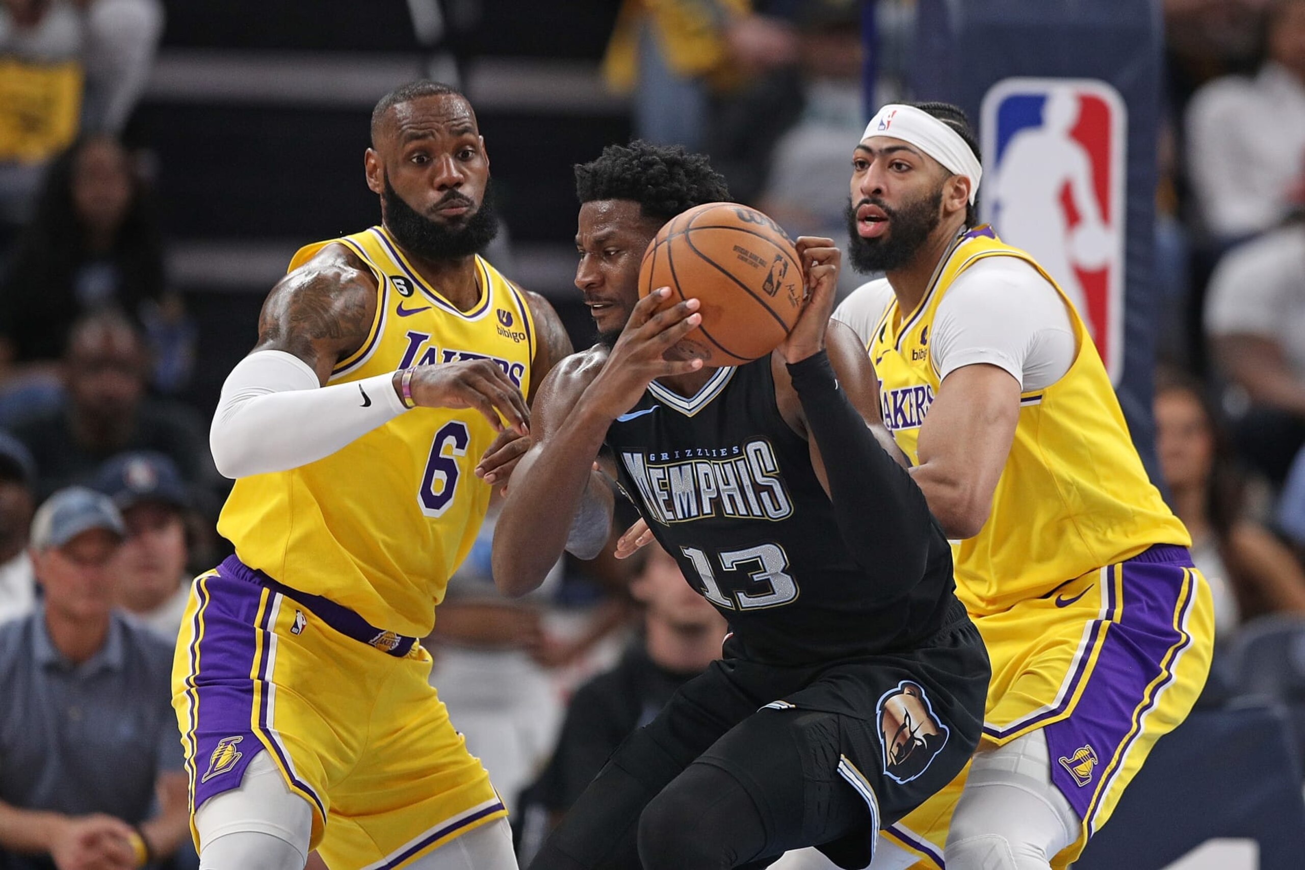 MEMPHIS, TENNESSEE - APRIL 19: Jaren Jackson Jr. #13 of the Memphis Grizzlies handles the ball during the first half against LeBron James #6 of the Los Angeles Lakers and Anthony Davis #3 of the Los Angeles Lakers during Game Two of the Western Conference First Round Playoffs at FedExForum on April 16, 2023 in Memphis, Tennessee. NOTE TO USER: User expressly acknowledges and agrees that, by downloading and or using this photograph, User is consenting to the terms and conditions of the Getty Images License Agreement at FedExForum on April 19, 2023 in Memphis, Tennessee. (Photo by Justin Ford/Getty Images)