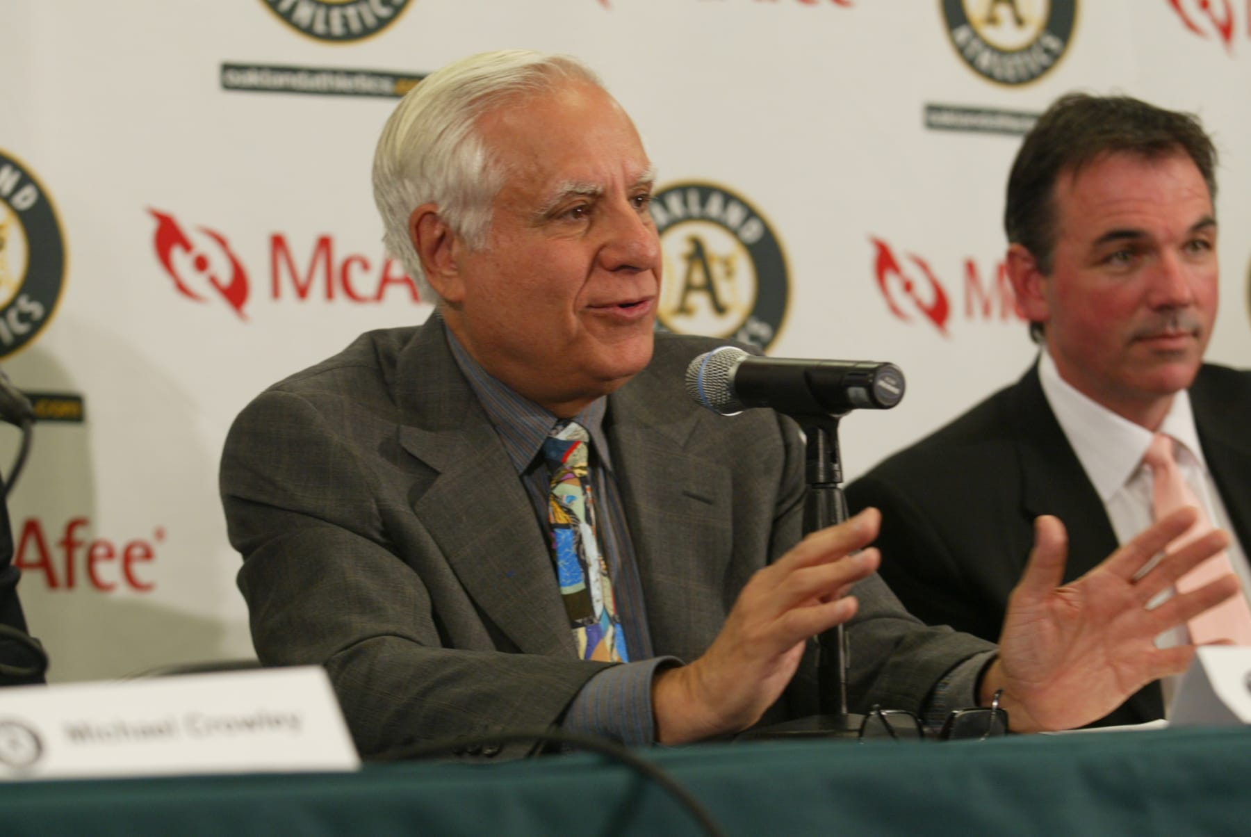 OAKLAND, CA - APRIL 1: Lewis Wolff (C), new co-owner and managing partner of the Oakland Athletics, speaks during a news conference with Athletics Vice President and General Manager Billy Beane (R) and President Michael Crowley (L) on April 1, 2005 in Oakland, California. Major League Baseball approved the sale of the Athletics on March 30th to a group headed by Wolff which includes his son, Keith Wolff, and billionaire John Fisher, son of Gap founder Donald Fisher. (Photo by Michael Zagaris /MLB Photos via Getty Images)