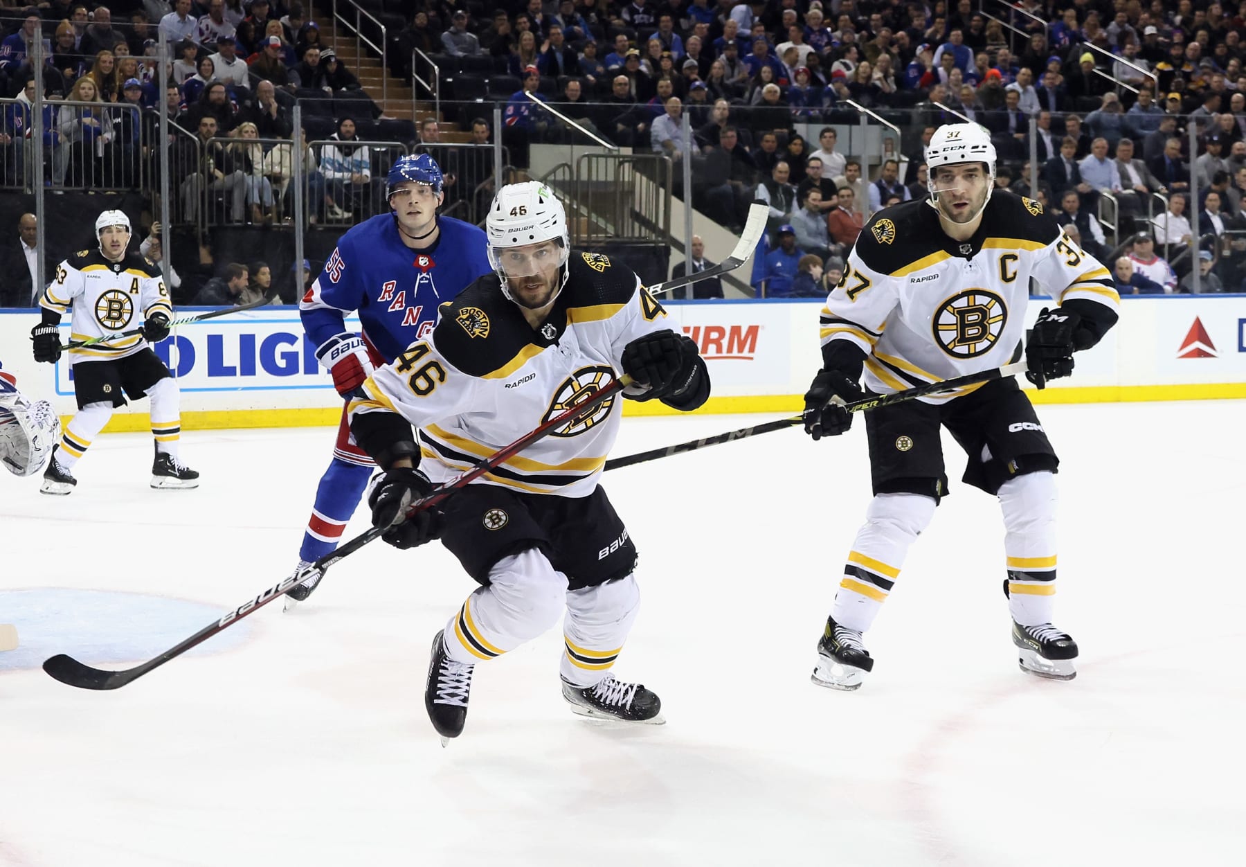 Boston Bruins forwards David Krejci (left) and Patrice Bergeron.